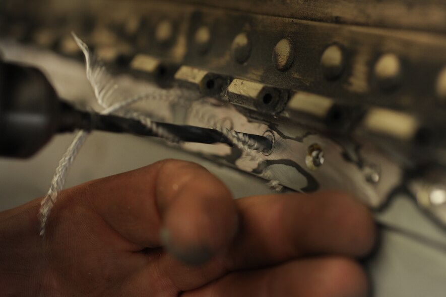 MOODY AIR FORCE BASE, Ga. -- A drill is used to remove rivets from an A-10C Thunderbolt II aircraft. The use of safety glasses is required to protect the workers’ eyesight while working with the drill. (U.S. Air Force photo by Airman 1st Class Benjamin Wiseman/RELEASED)