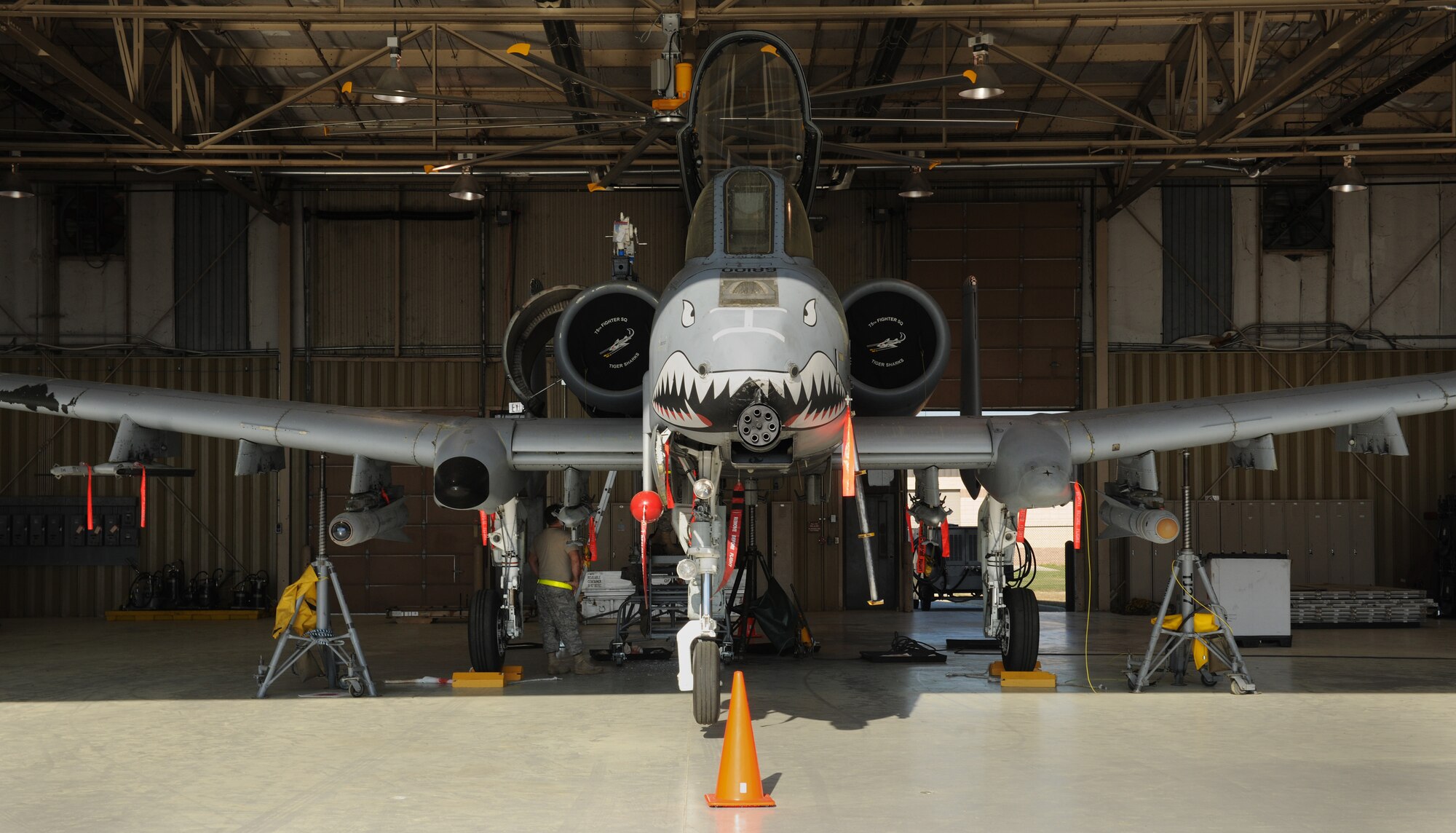 MOODY AIR FORCE BASE, Ga. -- An A-10C Thunderbolt II aircraft is brought into a hangar to have structural work done here April 1. The aircraft maintenance shop cut away a damaged hinge and remanufactured the part due to a shortage in stock. (U.S. Air Force photo by Airman 1st Class Benjamin Wiseman/RELEASED)