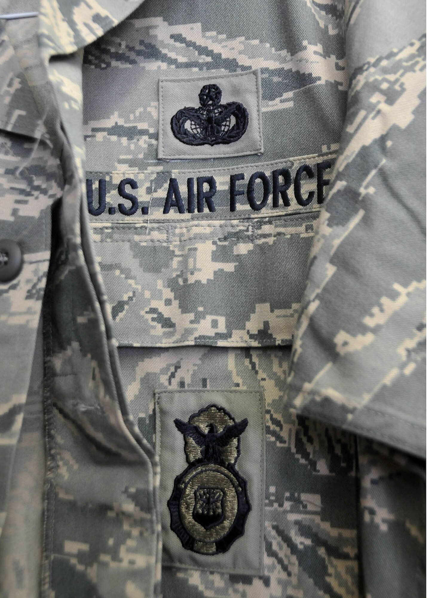 For every uniform, Billerbeck sews on two rank insignias on the sleeves, the name tape above the right chest pocket, the “US AIR FORCE” tape above the left chest pocket and in some cases the functional badges specific to each job duty (AFSC).