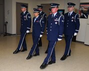 Members of the Lackland Honor Guard perform a hang step before approaching a casket during a practice session. The base Honor Guard is composed of three 10-man flights, all volunteers from various organizations on base. Each volunteer spends one week each month away from their primary job to render honors during the week and on weekends. (U.S. Air Force photo by Alan Boedeker)