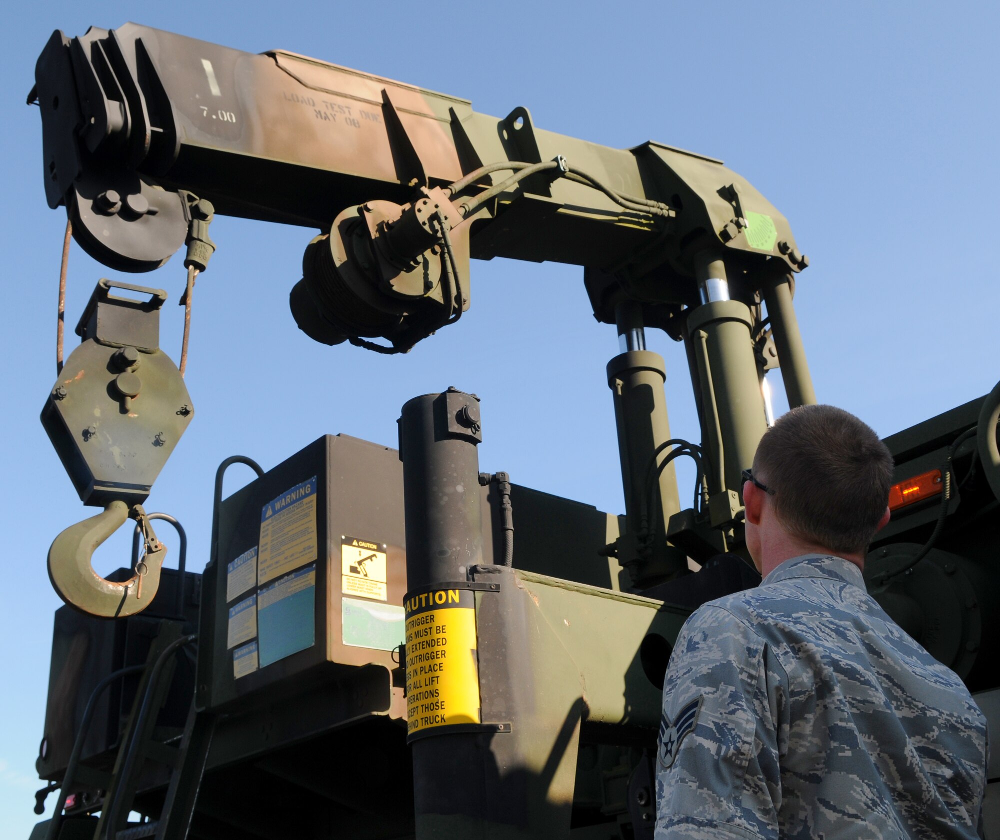 SPANGDAHLEM AIR BASE, Germany -- Senior Airman Daniel Huffman, 606th Air Control Squadron vehicle maintenance journeyman, practices setting up the crane of an M1089 wrecker’s during Exercise Emerging Fury April 23. The exercise gave Airmen hands-on experience and preparation for real-world convoys. (U.S. Air Force photo/Airman 1st Class Nick Wilson)