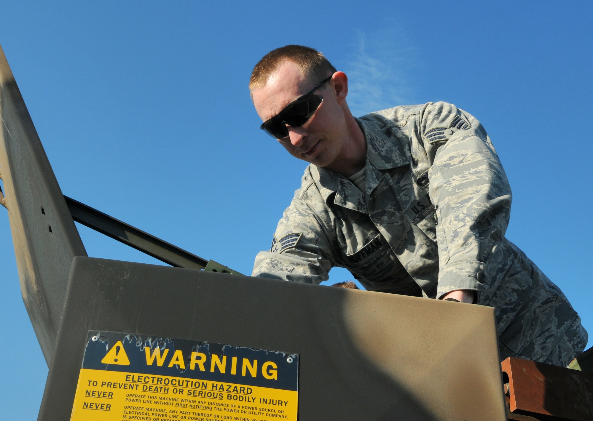 SPANGDAHLEM AIR BASE, Germany -- Senior Airman Daniel Huffman, 606th Air Control Squadron vehicle maintenance journeyman, retrieves plates used to provide a stabile base for the crane of an M1089 wrecker during Exercise Emerging Fury April 23. The exercise gave Airmen hands-on experience and preparation for real-world convoys. (U.S. Air Force photo/Airman 1st Class Nick Wilson)