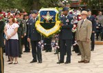 Brig. Gen. Leonard Patrick, 502nd Air Base Wing commander, and Chief Master Sgt. Juan Lewis, 502nd ABW command chief, accompanied by Robert Graves, 502nd ABW deputy commander, carry the 502nd ABW Joint Base San Antonio wreath during the annual Fiesta Pilgrimage to the Alamo April 19. The solemn procession begins at the Municipal Auditorium and ends in front of the Alamo where the wreaths are placed, while the names of the Alamo defenders are read. (U.S. Air Force photo by Robin Cresswell)
