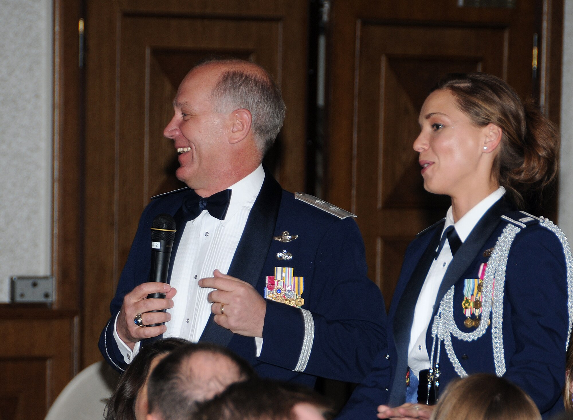 RAMSTEIN AIR BASE, Germany -- Maj. Gen. Ronald Ladnier (left), Commander of 17th Air Force, proposes Capt. Monica Gramling (right), his aide de camp, for Sergeant at Arms at the inaugural 17th Air Force Dining Out April 23, 2010 at the Officers Club here. (U.S. Air Force photo by Master Sgt. Jim Fisher)