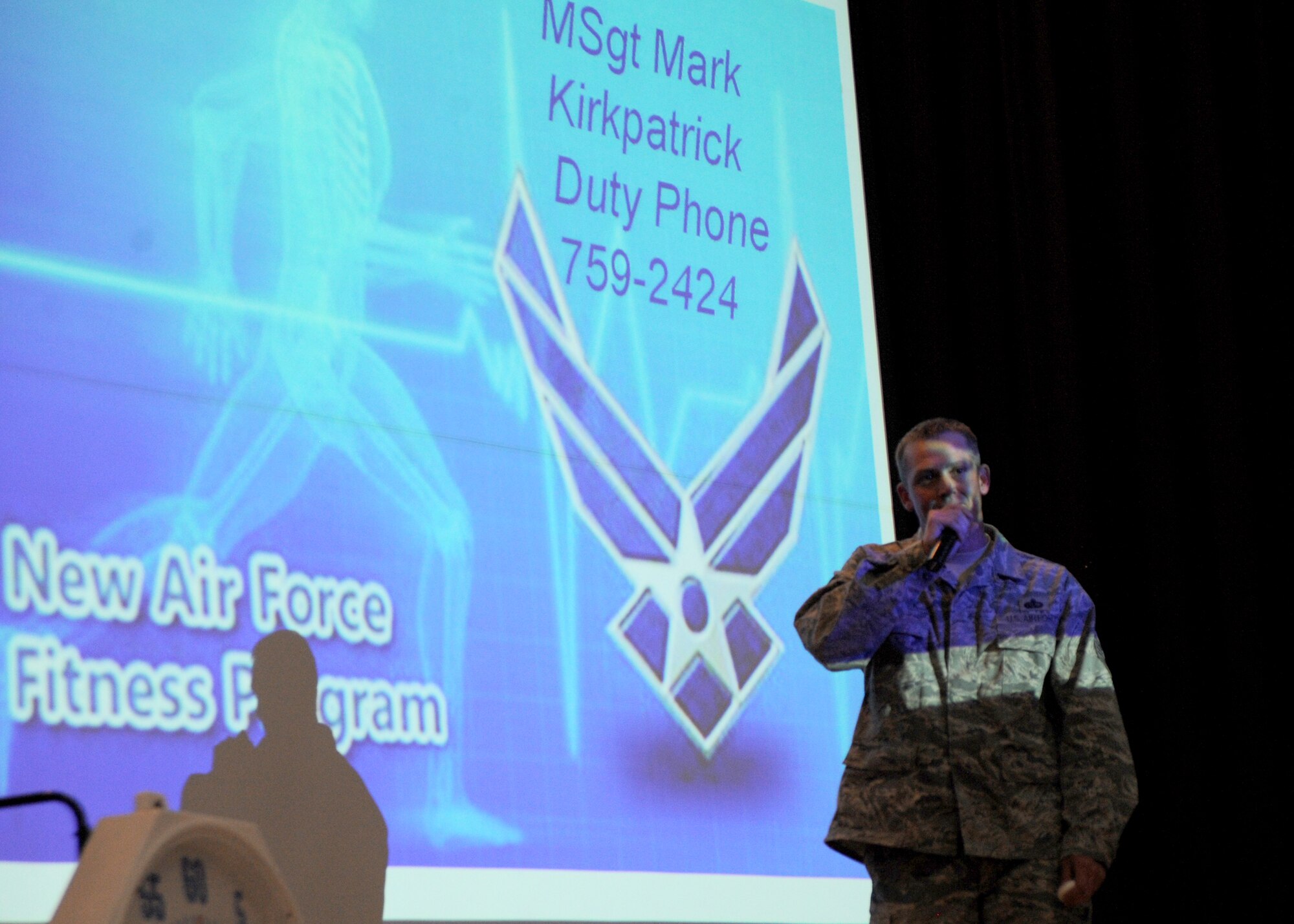 Master Sgt. Mark Kirkpatrick, 22nd Force Support Squadron fitness assessment cell superintendent, speaks to a crowd at the Junior Enlisted Airmen Summit about the Air Force’s revised fitness program in the Robert J. Dole Community Center ballroom, April 20, 2010, McConnell Air Force Base, Kan. Informing Airmen of these changes helps educate those who are unfamiliar with how the new standards can affect their score, and ultimately, their Air Force career. (U.S. Air Force photo/Airman 1st Class Andrea Salazar)
