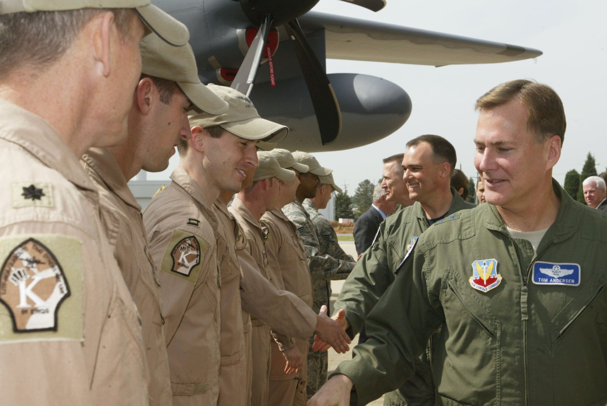 Maj. Gen. Thomas Andersen, Director of Requirements, Air Combat Command, Langley Air Force Base, Va., personally thanks and congratulates the crew of the first new HC-130J Super Hercules combat rescue tanker introduced after the unveiling portion of the Roll Out Ceremony held at the Lockheed Martin Aeronautics Company in Marietta, Ga., Apr. 19.