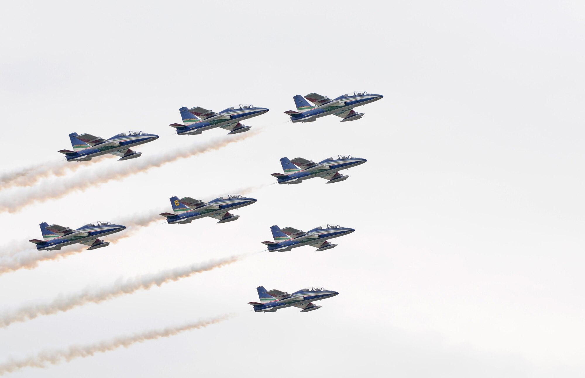 Jets from the Italian aerobatic team, Frecce Tricolori, perform a practice run April 23 over Aviano Air Base. Traditionally, the aerobatic team concludes their training here at Aviano the Friday prior to the beginning of their performance season. For more information on the Frecce Tricolori, visit www.freccetricolori.org. (U.S. Air Force photo/Staff Sgt. Justin Weaver)
