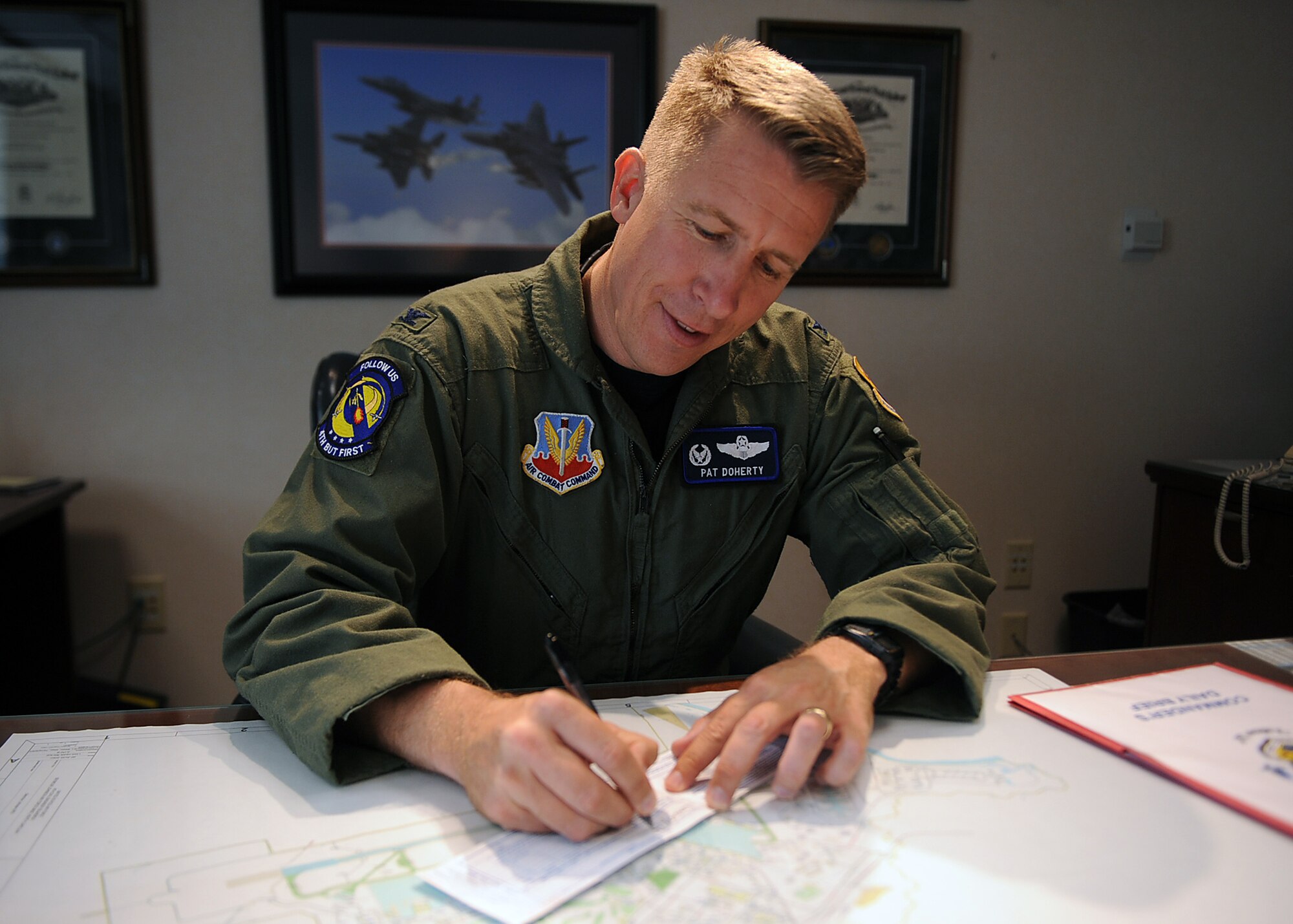 SEYMOUR JOHNSON AIR FORCE BASE, N.C. -- Col. Patrick Doherty signs an Air Force Assistance Fund form here April 23, 2010. The AFAF is an annual effort to raise funds for charities that provide support for active duty, retirees, reservists, Guard Airmen and their dependents, including surviving spouses. Colonel Doherty is the 4th Fighter Wing commander. (U.S. Air Force photo/Senior Airman Ciara Wymbs)  
