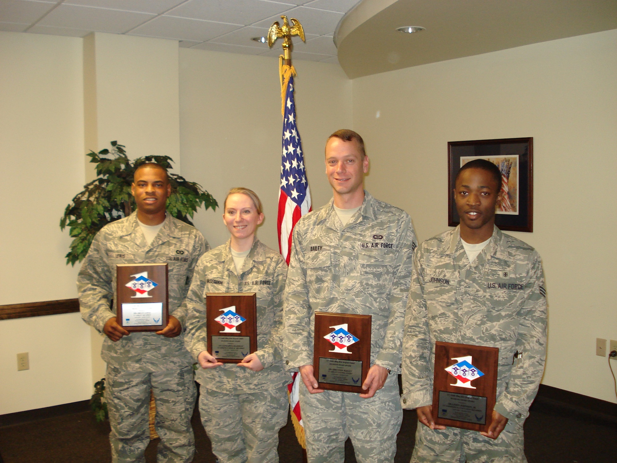 Senior Airmen Brian Lewis,  Brenton Bailey, John Johnson, and A1C Katharina Hassman from the 315th Airlift Wing, Charleston Air Force Base, S.C. were presented thier Diamond Sharp Awards April 25. Diamond Sharp Award winners are recognized for exemplifying the Air Force Core Values at work and through their volunteer efforts in the community. (U.S. Air Force Photo)