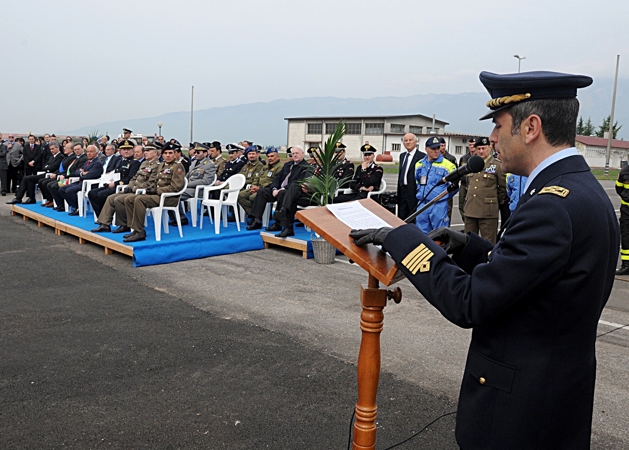 Col. Filippo Zampella, Italian Base commander, speaks during the ribbon cutting ceremony April 23 for the newly renovated Italian Air Force headquarters building in Area F.  After the ceremony, the Italian aerobatic team, Frecce Tricolori, performed a practice run for Aviano residents.   (U.S. Air Force photo by Senior Airman Tabitha M. Mans)