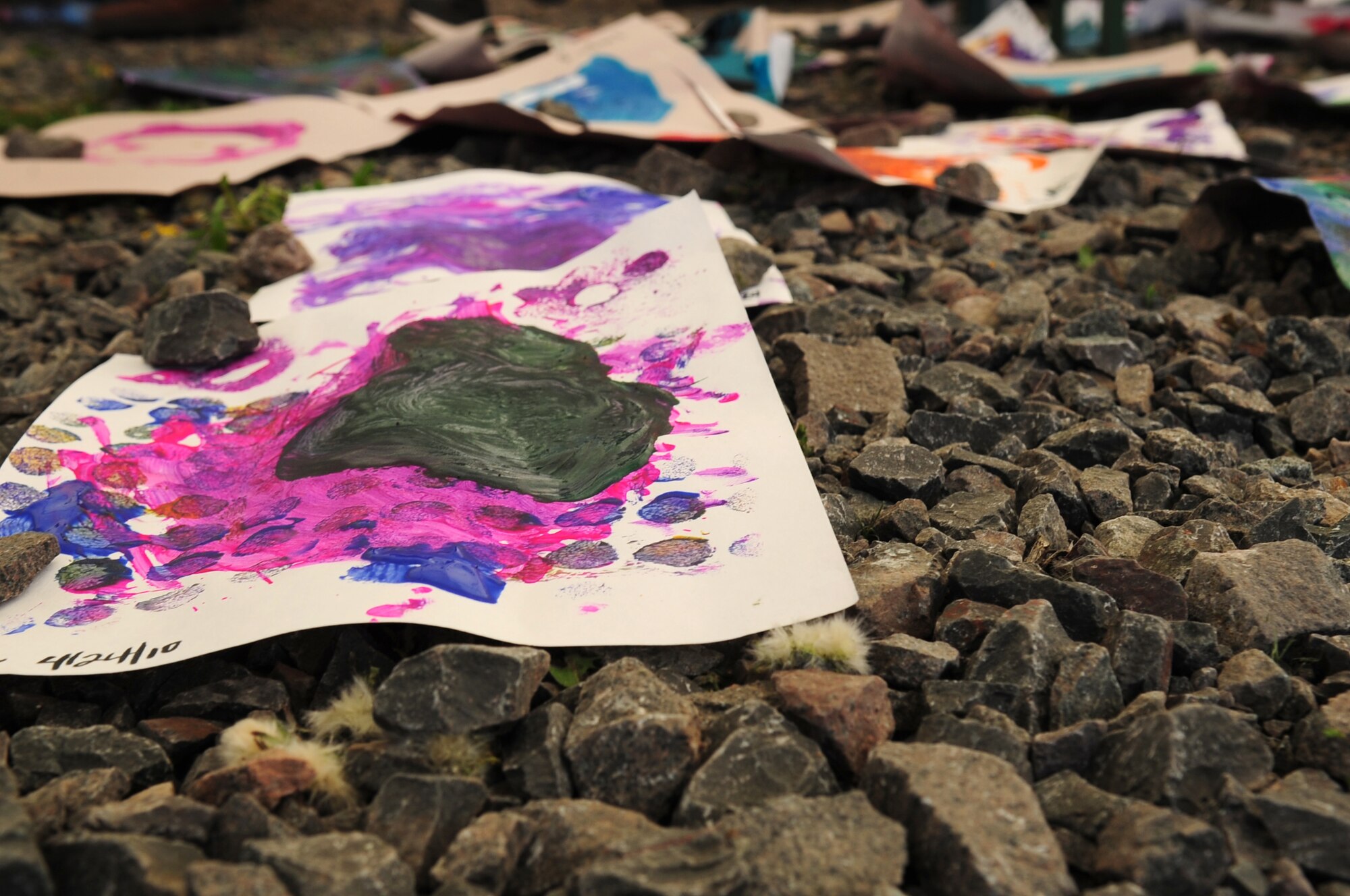 Artwork created by children dries in the craft tent at the Kids Festival on Pulaski Barracks, Germany, April 24, 2010.  The festival was held as a finale for Month of the Military Child.  Military members and NATO ID card holders were invited to come out and show their appreciation for the children. (U.S. Air Force photo by Staff Sgt. Jocelyn Rich)