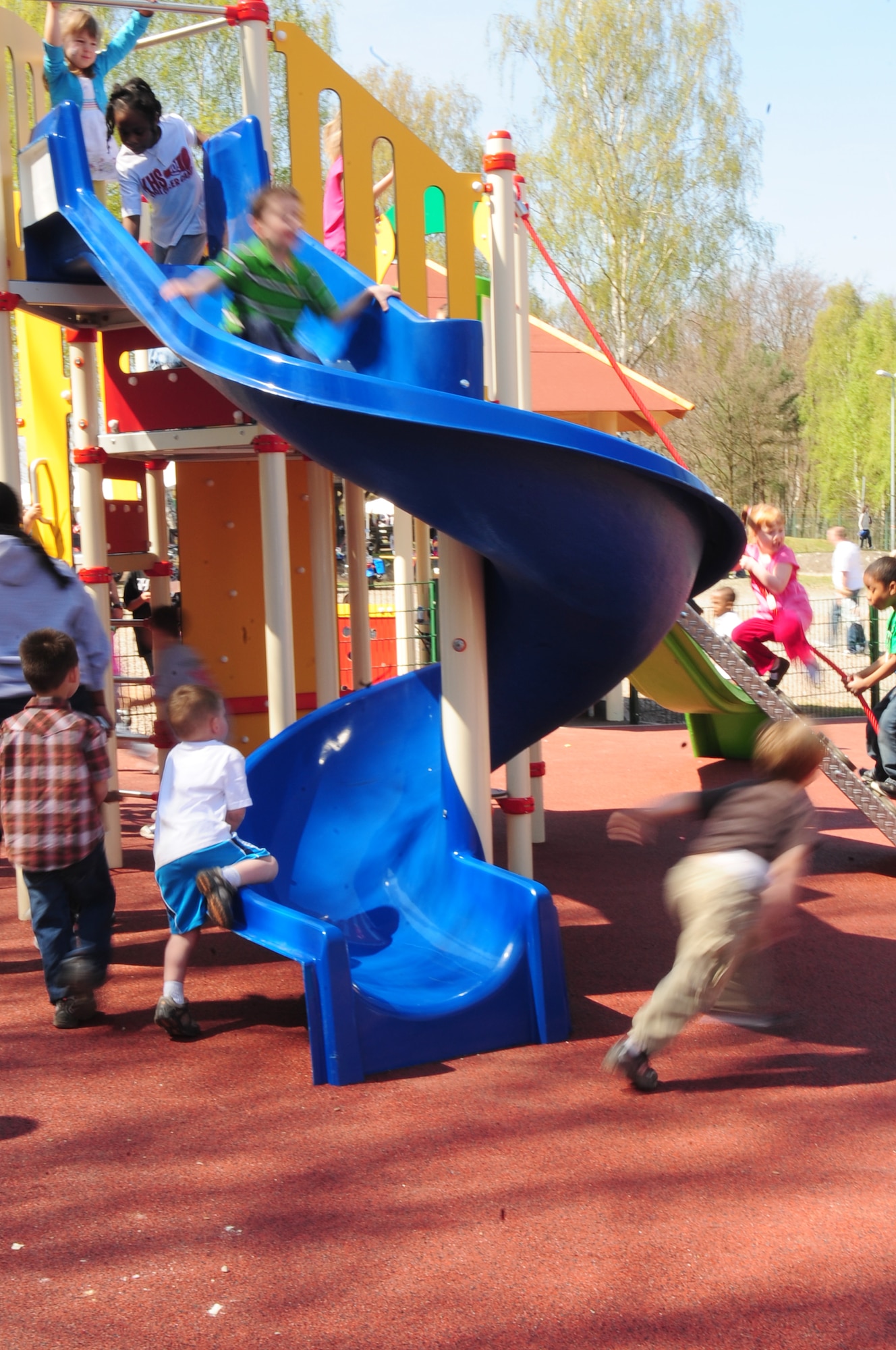 Children play at the newly opened boundless playground, the first of its kind in Europe, Pulaski Barracks, Germany, April 24, 2010.  The boundless playground is designed so that exceptional family members are able to play side-by-side with able bodied children. (U.S. Air Force Photo by Staff Sgt. Jocelyn Rich)
