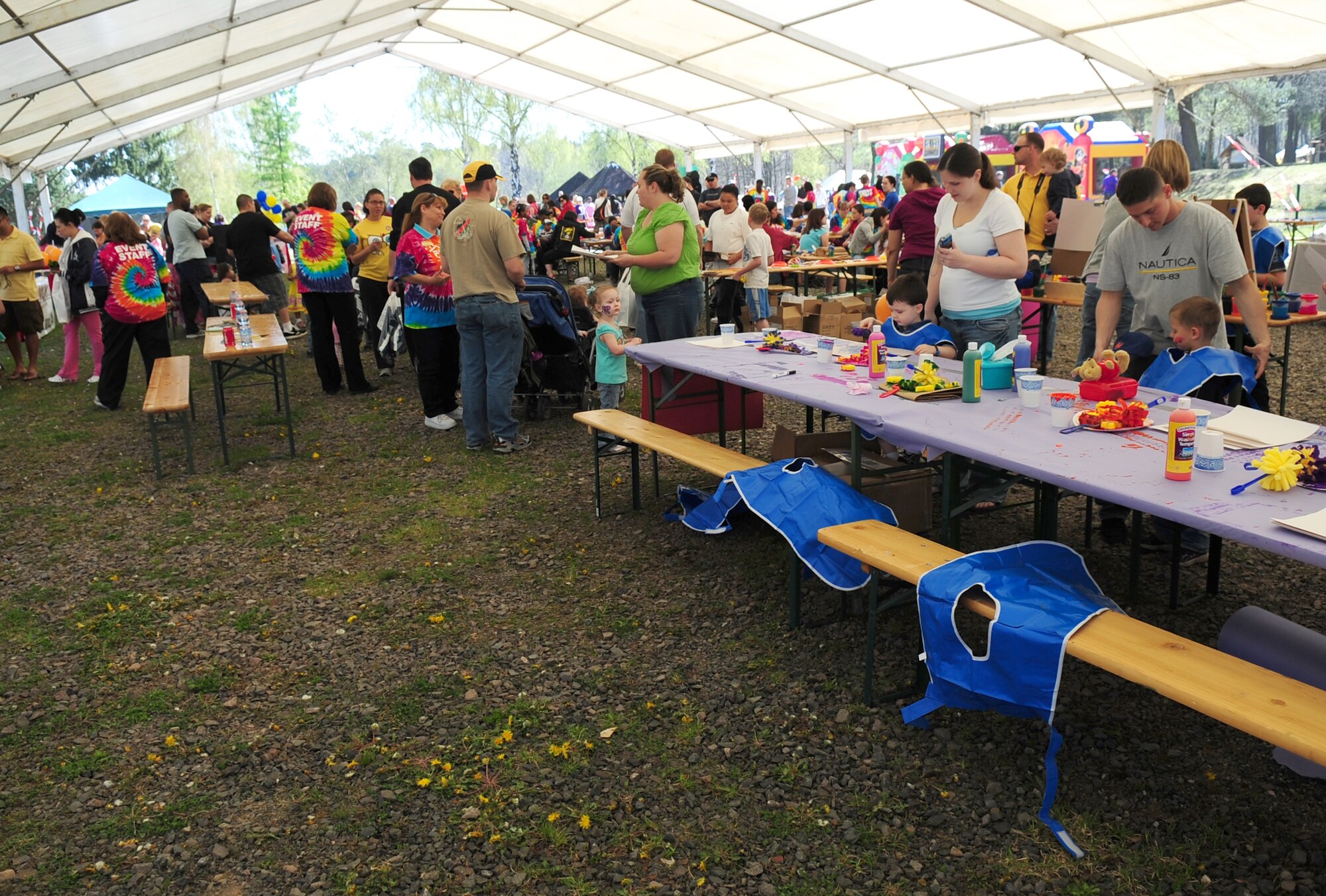 Craft tables are set up under cover, so that children and parents are able to participate in face painting, sponge painting, beading, and other activities as part of the Kids Festival on Pulaski Barracks, Germany, April 24, 2010. The festival was held as a finale for Month of the Military Child.  Military members and NATO ID card holders were invited to come out and show their appreciation for the children. (U.S. Air Force photo by Staff Sgt. Jocelyn Rich)