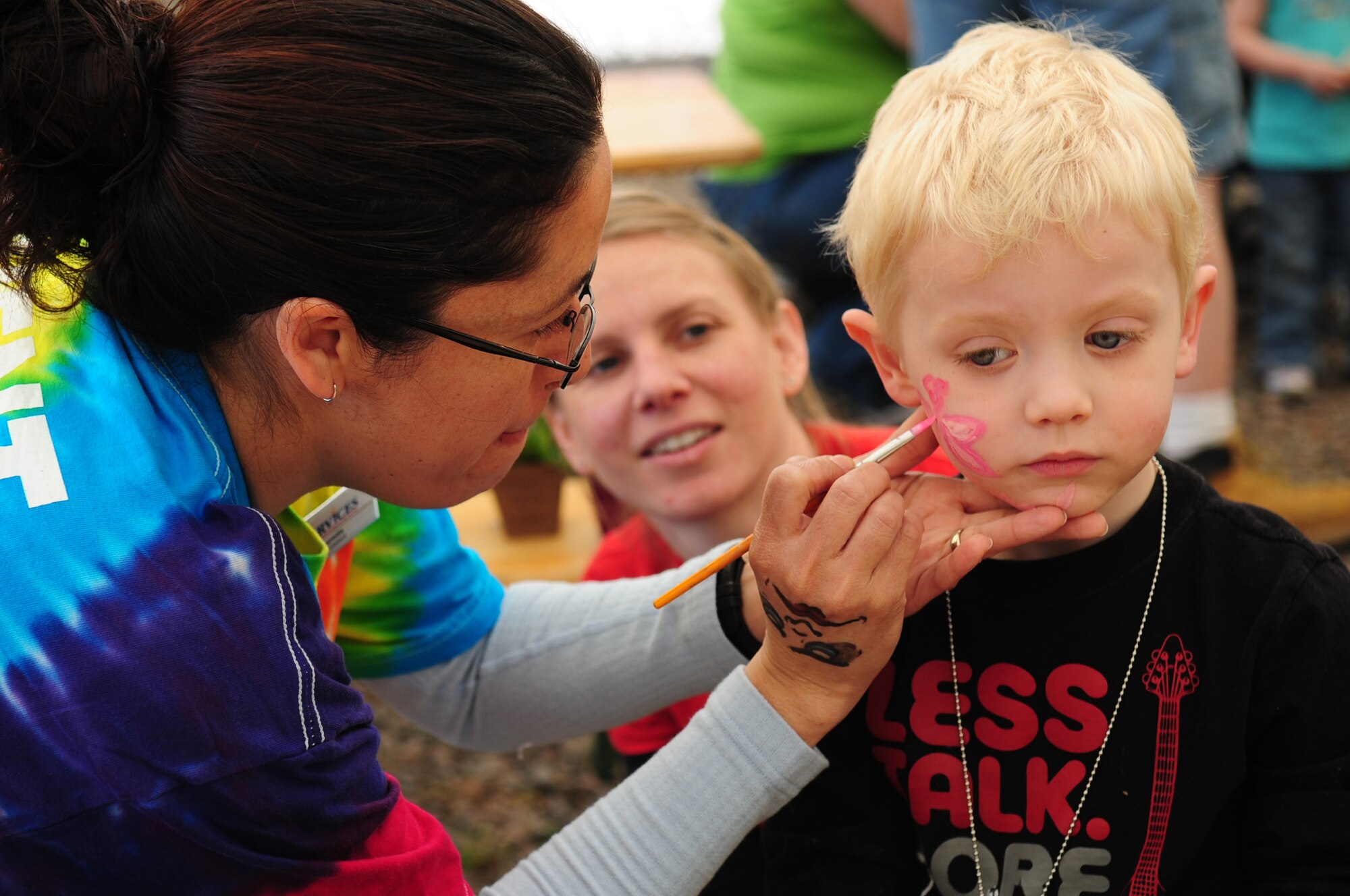 Calvin Wellman, 3, son of U.S. Air Force Staff Sergeants Nick and Sandi Wellman, both in the U.S. Air Forces Europe Band, gets his face painted at the Kids Festival, Pulaski Barracks, Germany, April 24, 2010.  The festival was held as a finale for Month of the Military Child.  Military members and NATO ID card holders were invited to come out and show their appreciation for the children.(U.S. Air Force photo by Staff Sgt. Jocelyn Rich)