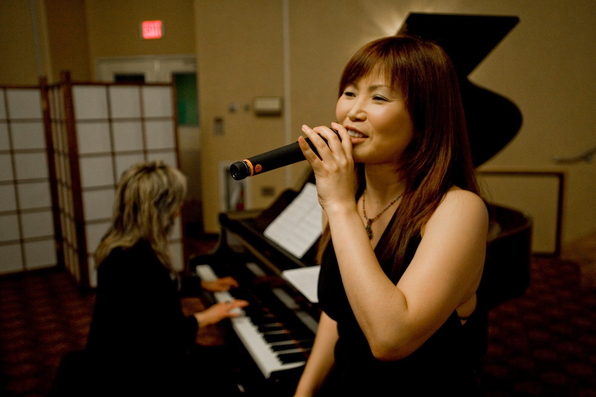 MISAWA AIR BASE, Japan -- Chiaki Takahashi performs during the 23rd Annual Japan Day Appreciation Dinner April 23 at the Collocated Club. Ms. Takahashi and her band performed renditions of popular American jazz music as well as Japanese pieces. (U.S. Air Force photo/Senior Airman Jamal D. Sutter)
