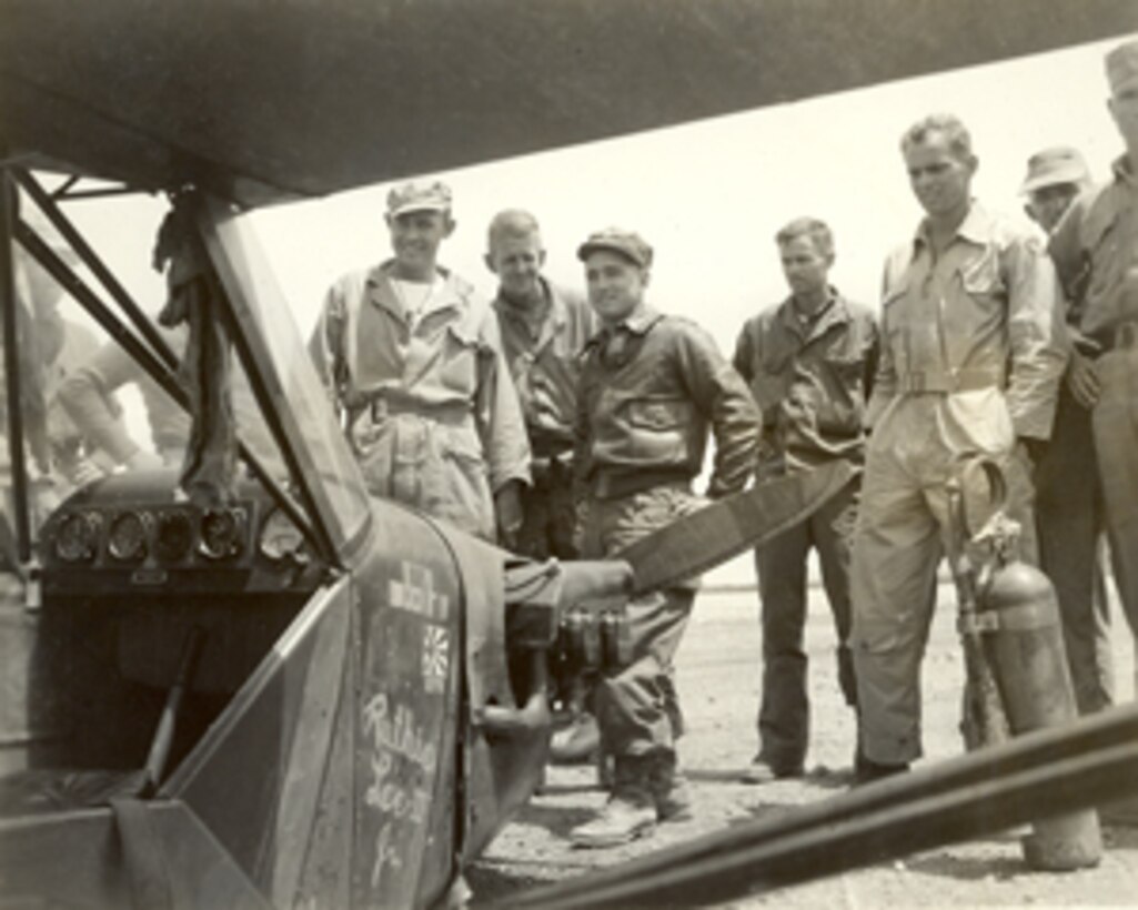 Ted J. Osenko Photograph Collection, number 1203.  Marines look at a crashed aircraft (Ruthie Lee II Jr.)