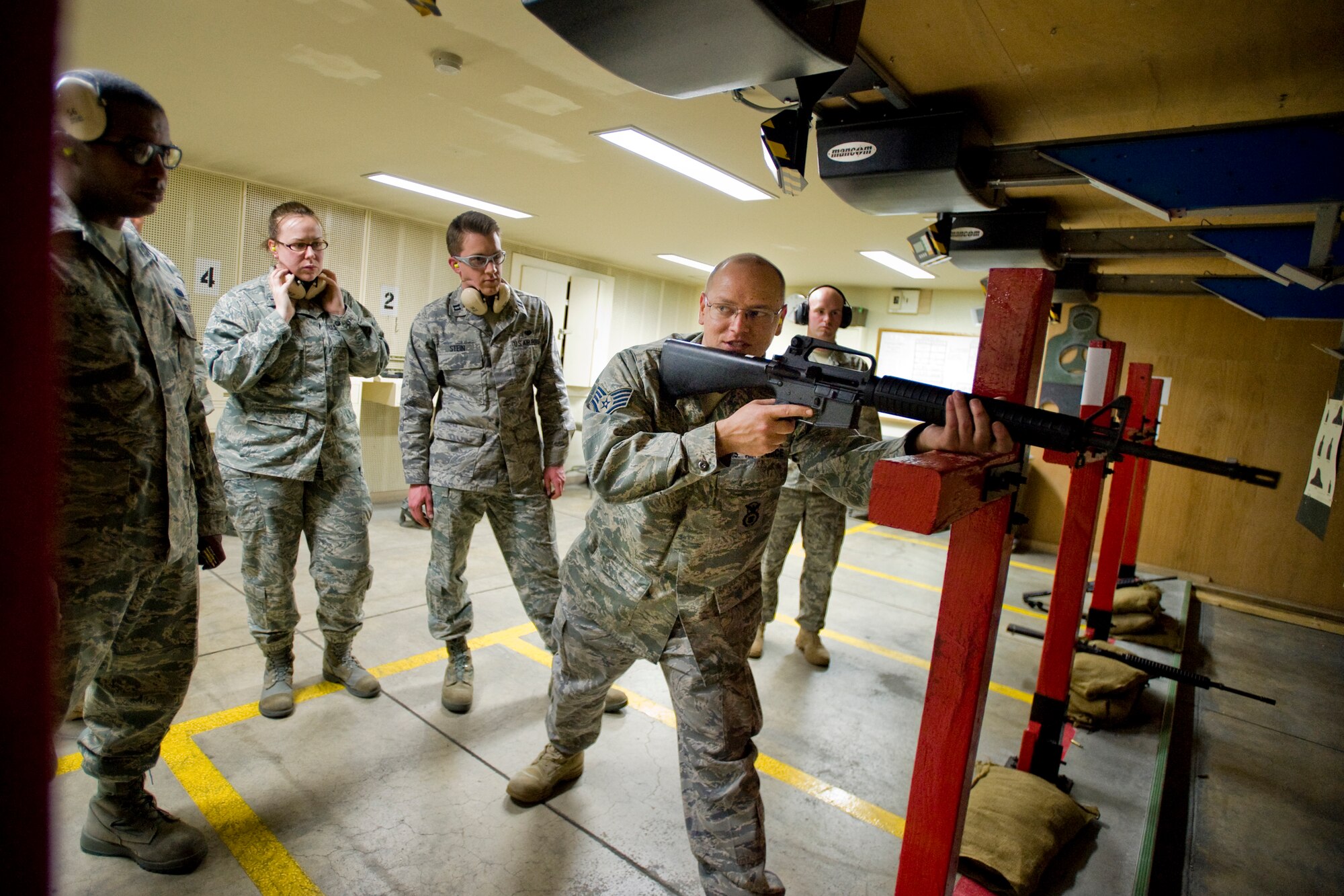 MISAWA AIR BASE, Japan -- Staff Sgt. Theodore Chmurynski, 35th Security Forces Squadron combat-arms instructor, demonstrates the standing-supported firing position April 27 at the combat arms training and maintenance range. The standing-supported position is one of several firing positions students train on to qualify with their weapon. (U.S. Air Force photo/Senior Airman Jamal D. Sutter)