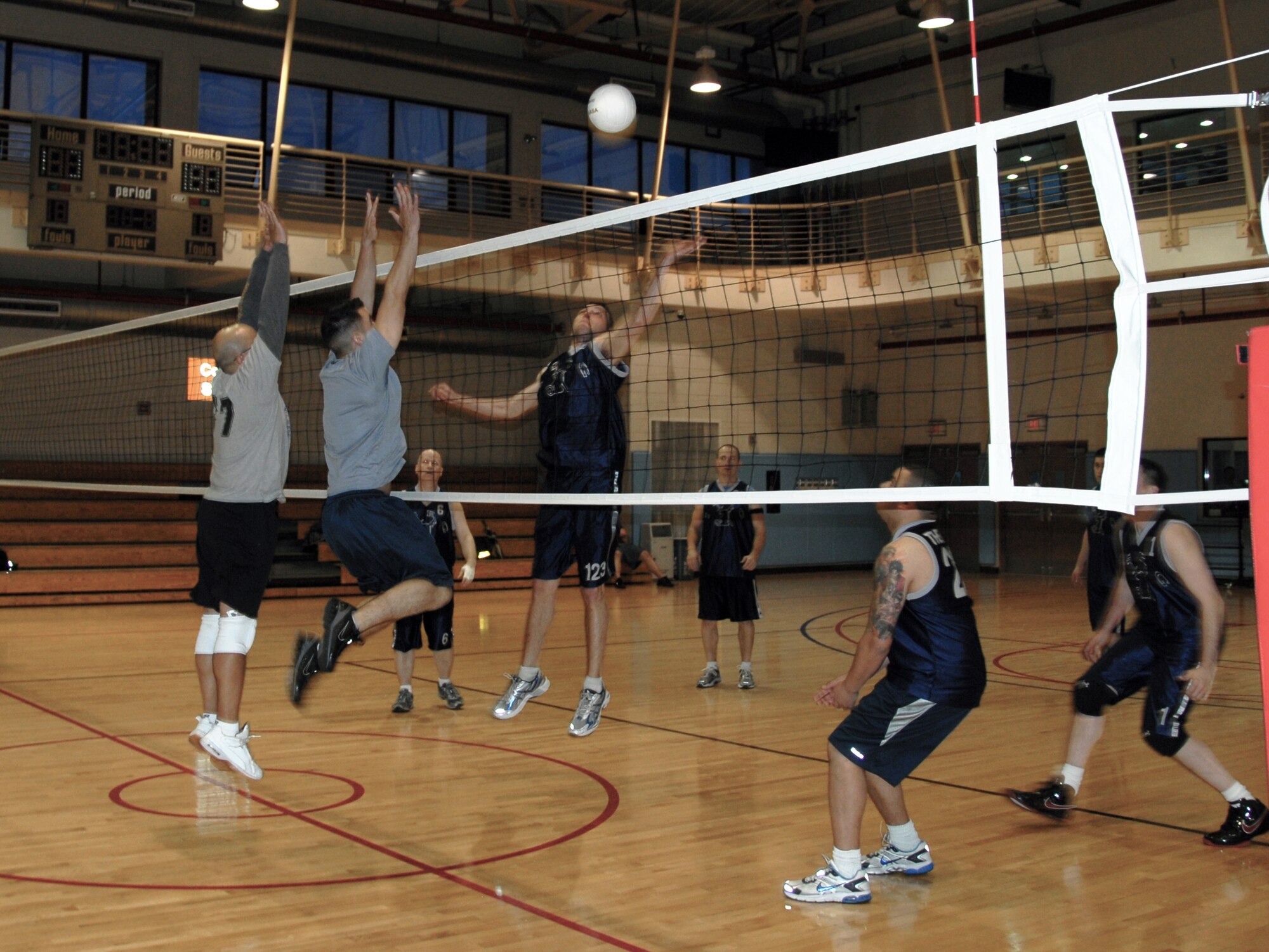 The 51st Fighter Wing intramural volleyball team, left, competes against the 694th Intelligence Group team April 27 at the fitness center on Osan Air Base, Republic of Korea. The 694th IG team won in straight sets, improving their record to 7-1. The 51st FW team, comprised of the 51st Comptroller Squadron and wing staff agencies, dropped to 5-3. Four games remain in the regular season, which concludes May 13. (U.S. Air Force photo/Staff Sgt. Eric Burks)