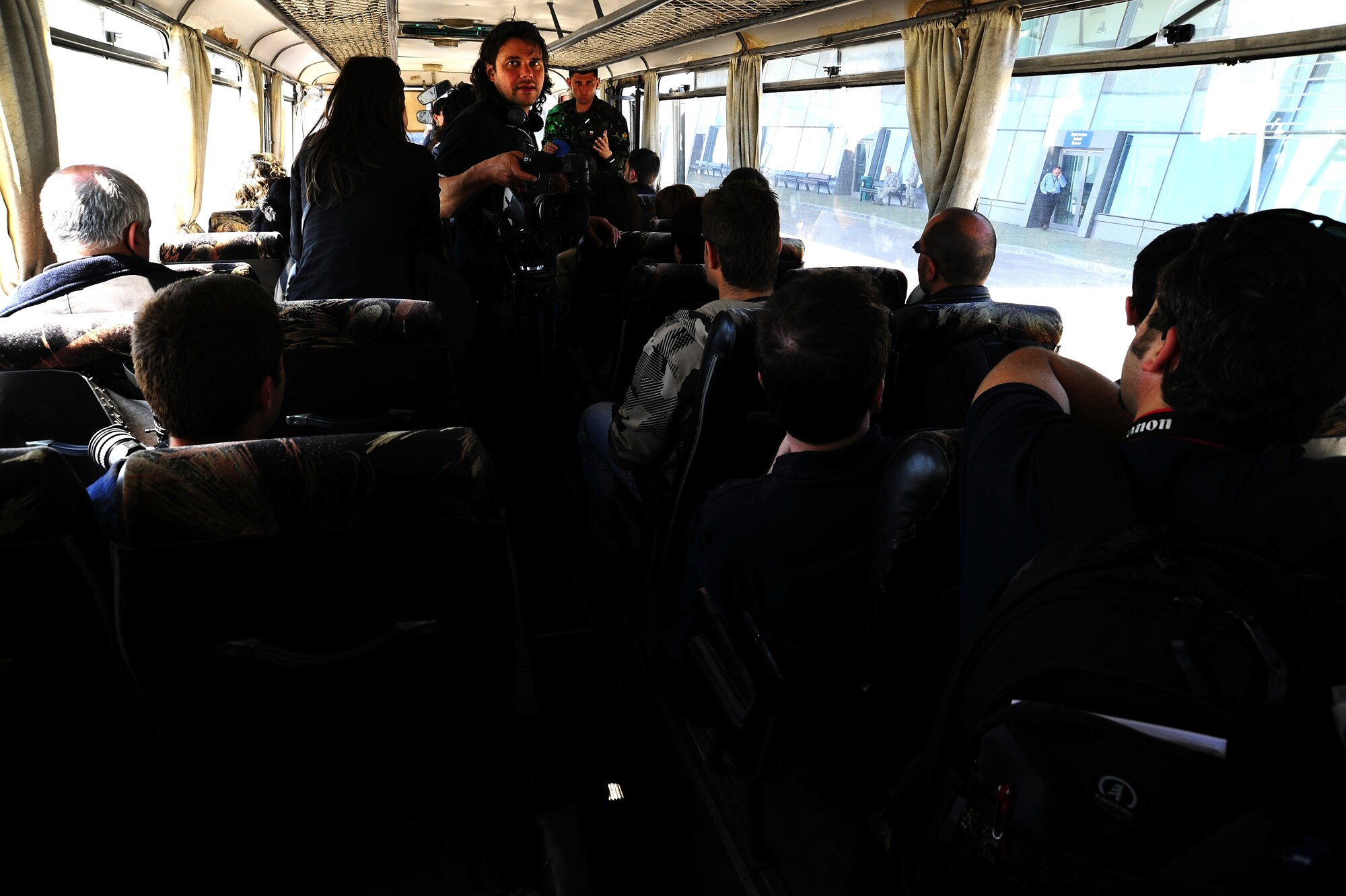 Members of the Bulgarian media ride a bus to the drop zone where they will observe U.S. and Bulgarian paratroopers jumping from a C-130J during Thracian Spring 2010’s media day at Plovdiv Airport, April 27, 2010. Thracian Spring is an exercise composed of aircrew, maintenance, airfield management, aerial port, security forces, and logistics personnel that combine their skill in an effort to build and strengthen the United States and Bulgarian Air Forces’ bond while improving interoperability with our partner NATO nation. (U.S. Air Force photo by Master Sgt. Quinton T. Burris)