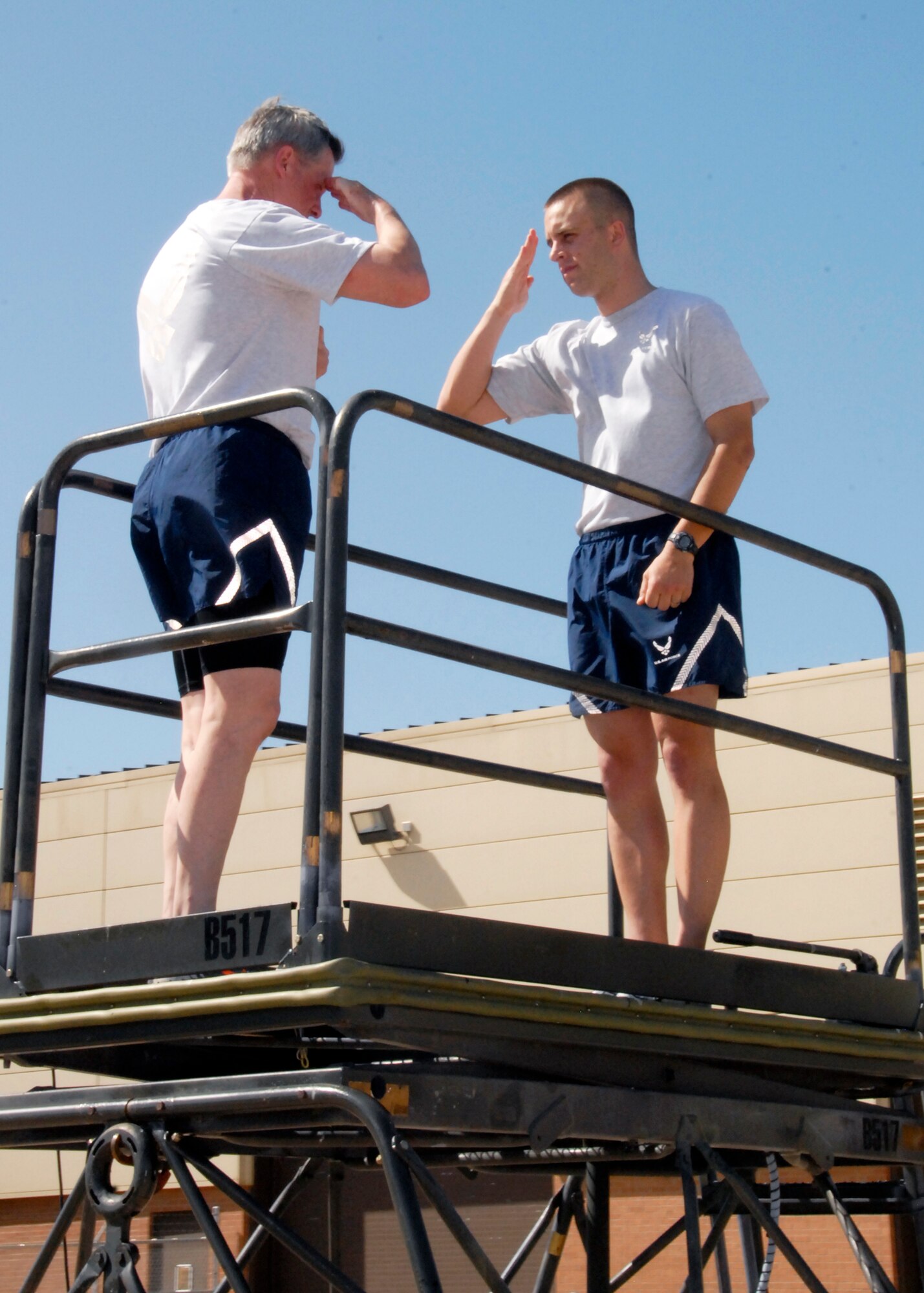 Brig. Gen. O.G. Mannon, 82nd Training Wing commander, coins the 82nd Training Wing master of drill and ceremonies, for setting the example and being an exemplary Airman after the Wing Run April 23, 2010. Sergeant Gust wrote a commentary “Eyes Right”, in which he spoke about the team effort and pride of the 82nd TRW during every parade at Sheppard. (U.S. Air Force photo/Mike Litteken)