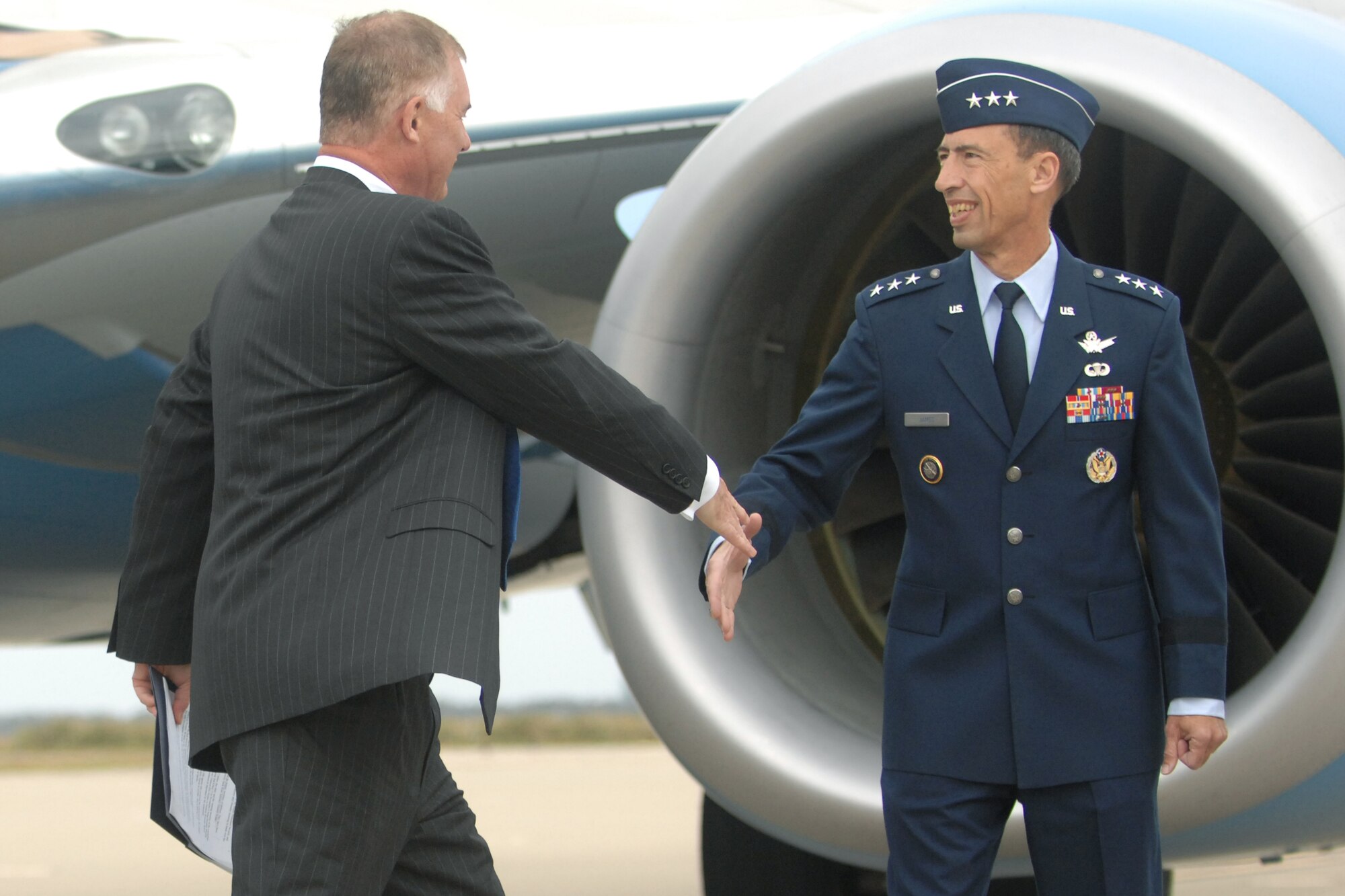 VANDENBERG AIR FORCE BASE, Calif. - Lt. Gen. Larry James, the 14th Air Force commander, greets Mr. William Lynn, the U.S. Deputy Secretary of Defense, upon his arrival to Vandenberg Tuesday, April 27, 2010. Mr. Lynn is scheduled to tour the Joint Space Operations Center here during his visit. (U.S. Air Force photo/Senior Airman Christopher Hubenthal)