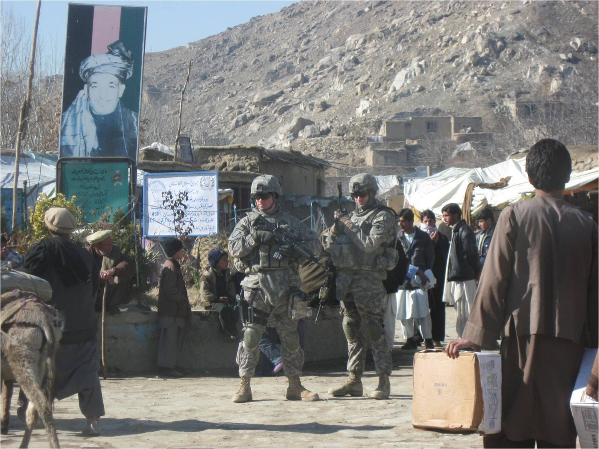 Sergeant Wiese, left, and Army Sgt. 1st Class Terry O'Neil participate in a Key Leader Engagement security detail.  A KLE is a meeting between the U.S. civil affairs team leader and a key leader from the Nijrab Valley, perhaps a government official or police chief.  (Courtesy Photo)


