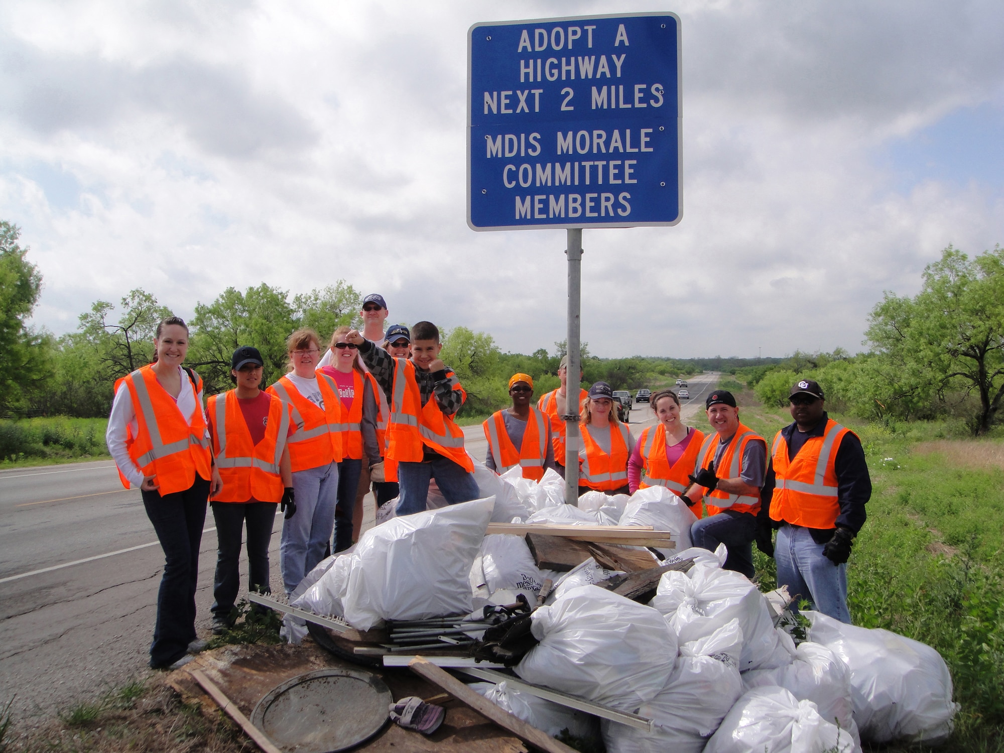 Members of the 59th Medical Inpatient Squadron and their families participated in the 2010 Don't Mess with Texas Trash-Off annual event April 10 along the squadron's adopted highway, a section of State Highway 1604. In nearly four hours, the team cleaned and cleared the highway of more than 20 bags of litter. (U.S. Air Force courtesy photo)

                     