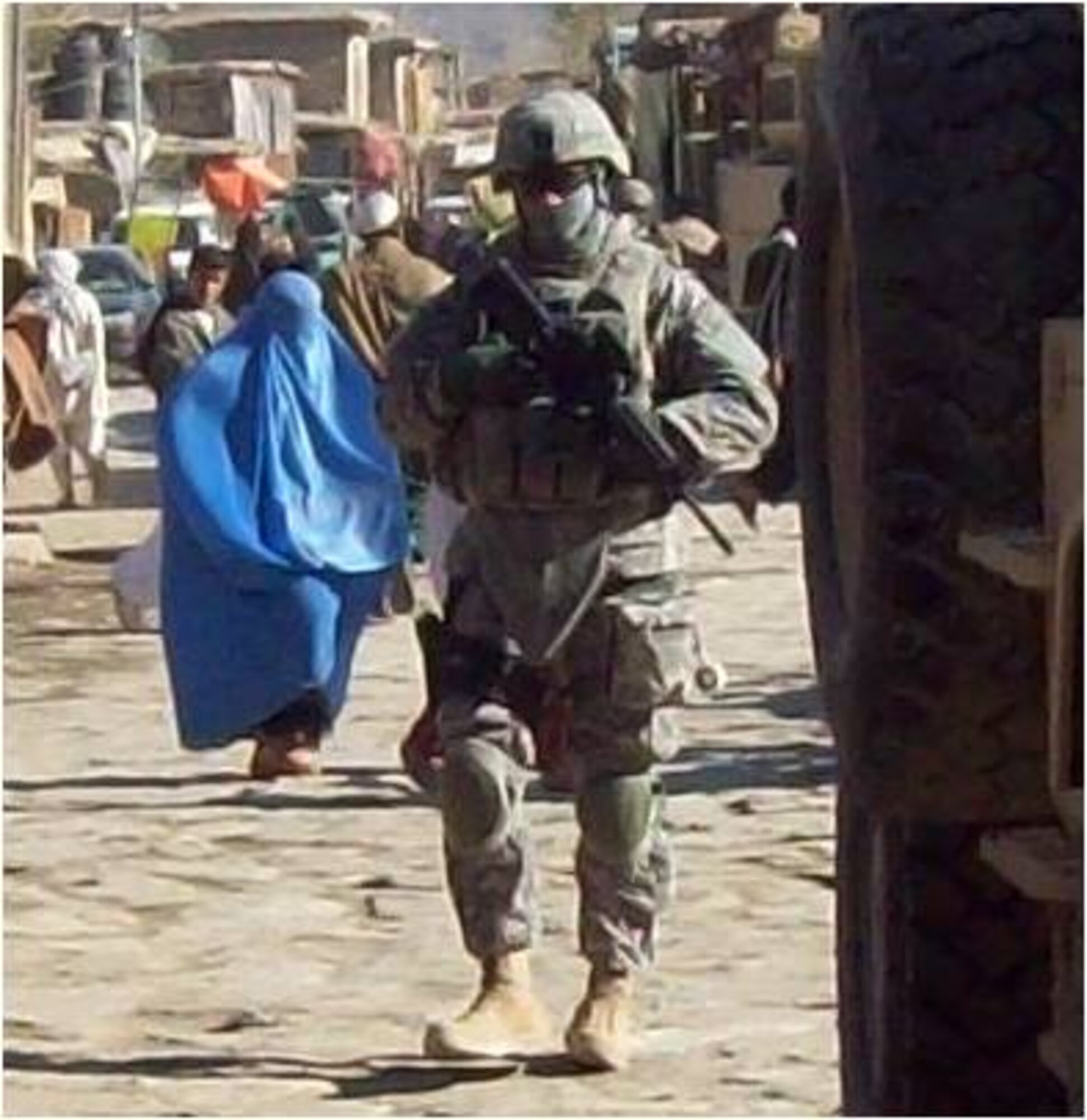 Sergeant Wiese is on security duty in the Nijrab bazaar during a Key Leader Engagement.  A KLE is a meeting between the U.S. civil affairs team leader and a key leader from the Nijrab Valley, perhaps a government official or police chief. (Courtesy Photo)
