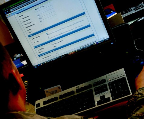 OFFUTT AIR FORCE BASE, Neb. -- Staff Sgt. James M. Hodgman, non-commissioned officer in charge of internal information for the 55th Wing Public Affairs Office, updates his information in the AtHoc emergency notification system here April 27. U.S. Air Force Photo by Jeff Gates 