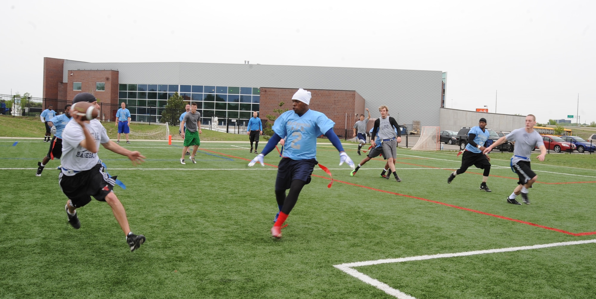The McConnell Air Force Base varsity flag football team competes against a Wichita State University intramural team during a Young Men's Christian Association spring league tournament, April 18, 2010, McConnell Air Force Base, Kan. The base team has 15 active-duty military members from different career fields. The team is currently playing in a six-week season for a position in the YMCA play-offs. Additionally, in October of 2010 at Kansas City, the team will play in a benefit tournament aimed at funding shelters for battered women. (U.S. Air Force photo/Senior Airman Maria Ruiz)