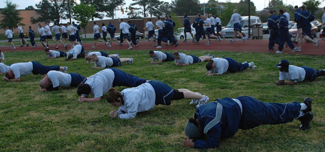 LANGLEY AIR FORCE BASE, Va. - Airmen from the “Back to  Basics” class perform prone bridge hands for 30 seconds during a morning workout April. 26. The eight-week course is designed to help Airmen improve their physical training performance through a rigorous daily workout program. (U.S. Air Force photo/Airman 1st Class Gul Crockett)
