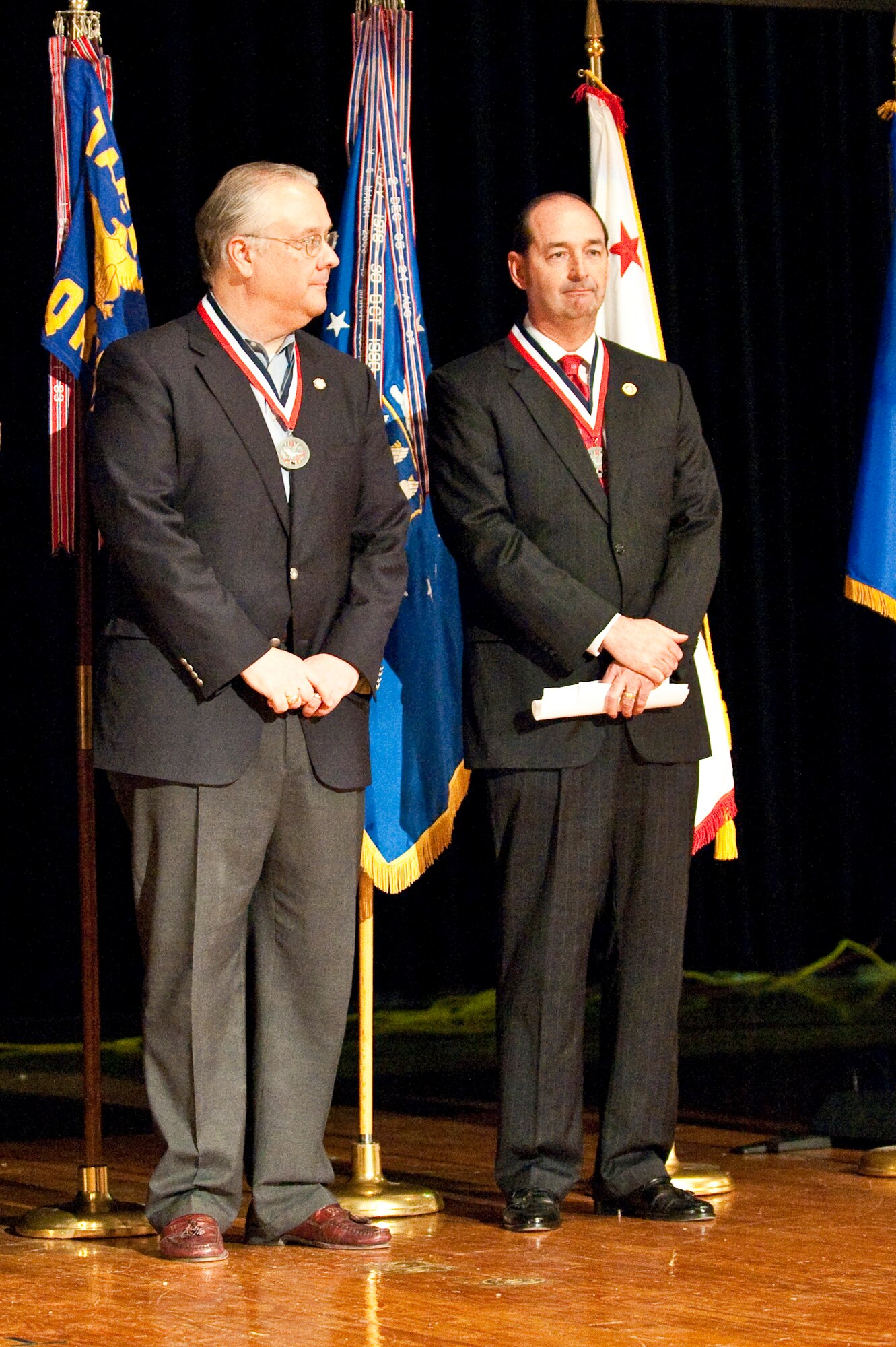 State Sen. David L. Williams, let, and State Rep. Rocky Adkins accept their Department of Defense Centers of Influence Awards during a ceremony held April 17, 2010 at Louisville Male High School in Louisville, Ky. The awards recognize individuals who have been especially supportive of military service members since Sept. 11, 2001. (U.S. Air Force photo/Maj. Dale Greer)