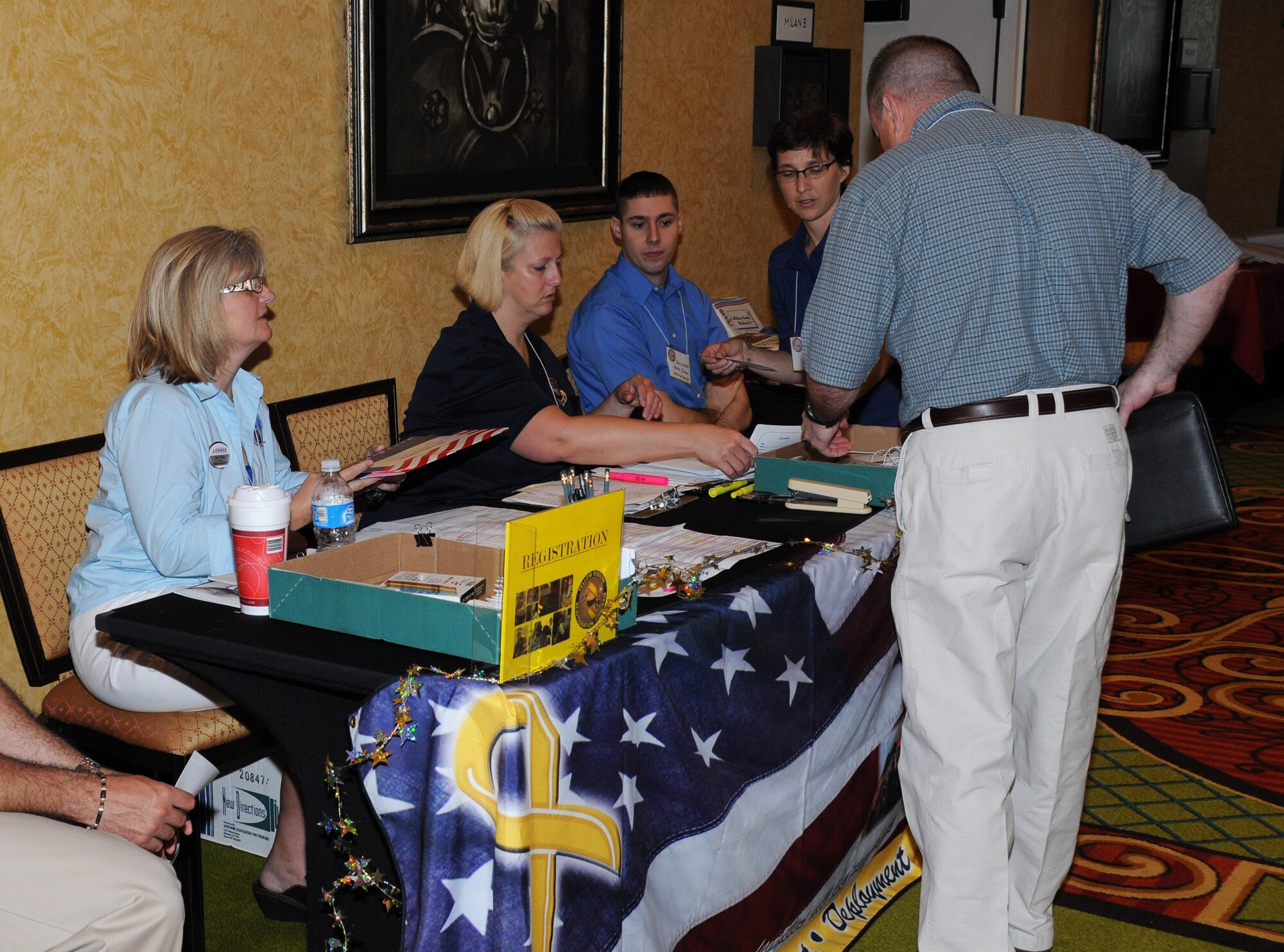 Functional staff for the 927th Air Refueling Wing from MacDill Air Force Base, Fla., check in Airmen at the Yellow Ribbon Program, coordinated jointly with the 920th Rescue Wing from Patrick Air Force Base, Fla., at the Renaissance Hotel in Orlando, Fla. April 24-25, 2010. The Yellow Ribbon Program is designed specifically for Guardsmen, Reservists and their families, allowing them to see the services available to them before, during and after deployments. (U.S. Air Force photo by Senior Airman Anna-Marie Wyant)
