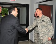 Col. Randall Ogden (right), wing commander for the 916th Air Refueling Wing, welcomes Mr. Tad Dunn to the 77th/911th Air Refueling Squadron building. Mr. Dunn is the deputy director of the North Carolina Military Foundation.