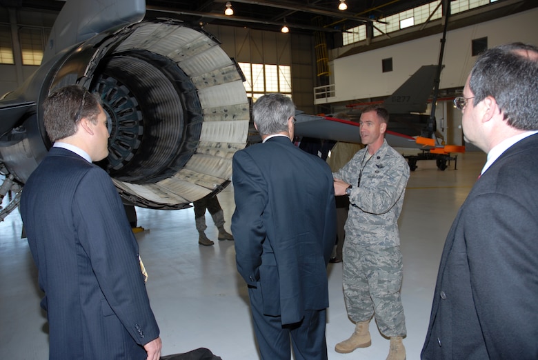 Lt. Col. Jeffrey Bozard, 113 AMXS Squadron Commander, explains how F-16 afterburners work to business leaders from The Kaplan Public Service Foundation in the 113 AW hangar, April 22. (U.S. Air Force photo by Tech Sgt. Tyrell Heaton/Released)