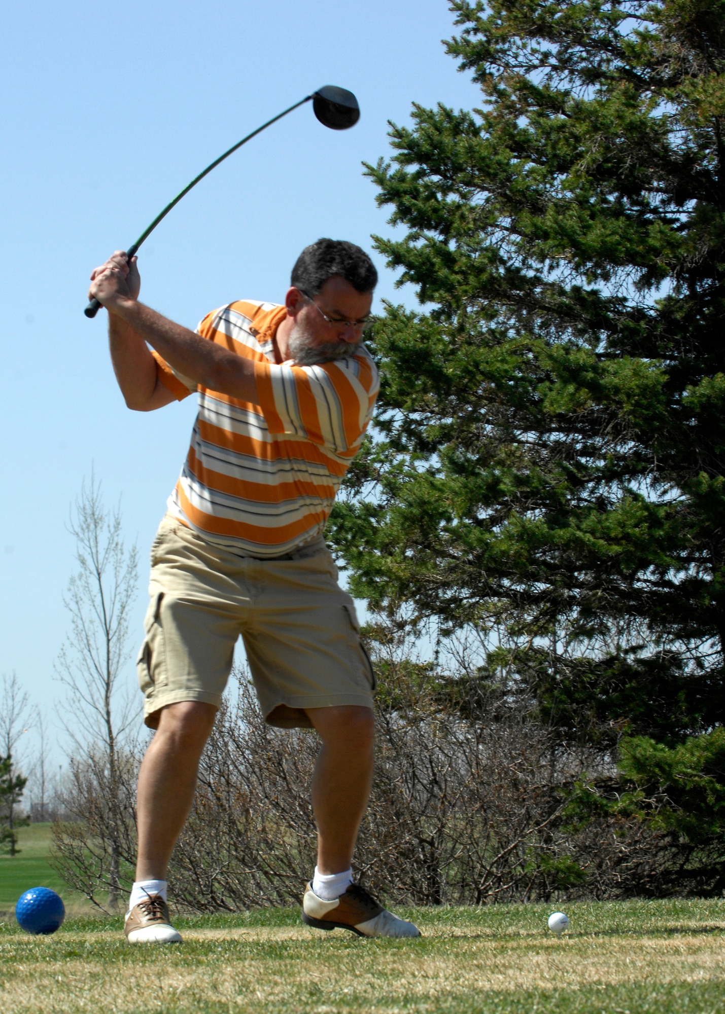 MINOT AIR FORCE BASE, N.D. -- David Adcox, 5th Medical Group medical counter chemical biological radiological nuclear analyst, takes a swing at the Rough Rider Golf Course here April 22. The golf course is now open for business and open from 8 a.m. to dark. (U.S. Air Force photo by Senior Airman Ashley N. Avecilla)