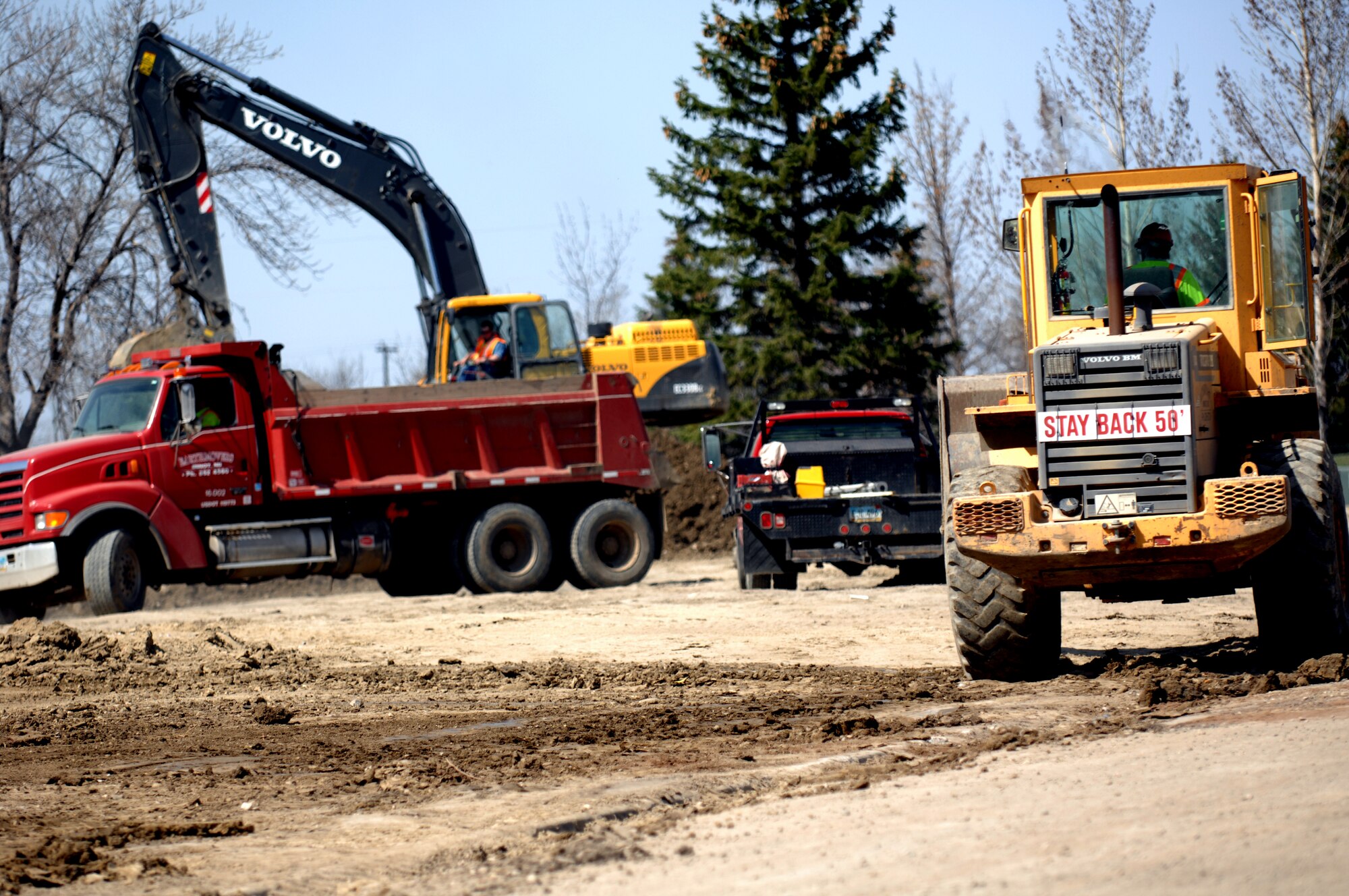 MINOT AIR FORCE BASE, N.D. -- Construction workers tear down what’s left of a building foundation on Linden loop here April 20. Base workers are demolishing many of the older homes in base housing to make way for new homes in the future.  (U.S. Air Force photo by Airman 1st Class Aaron-Forrest Wainwright) 