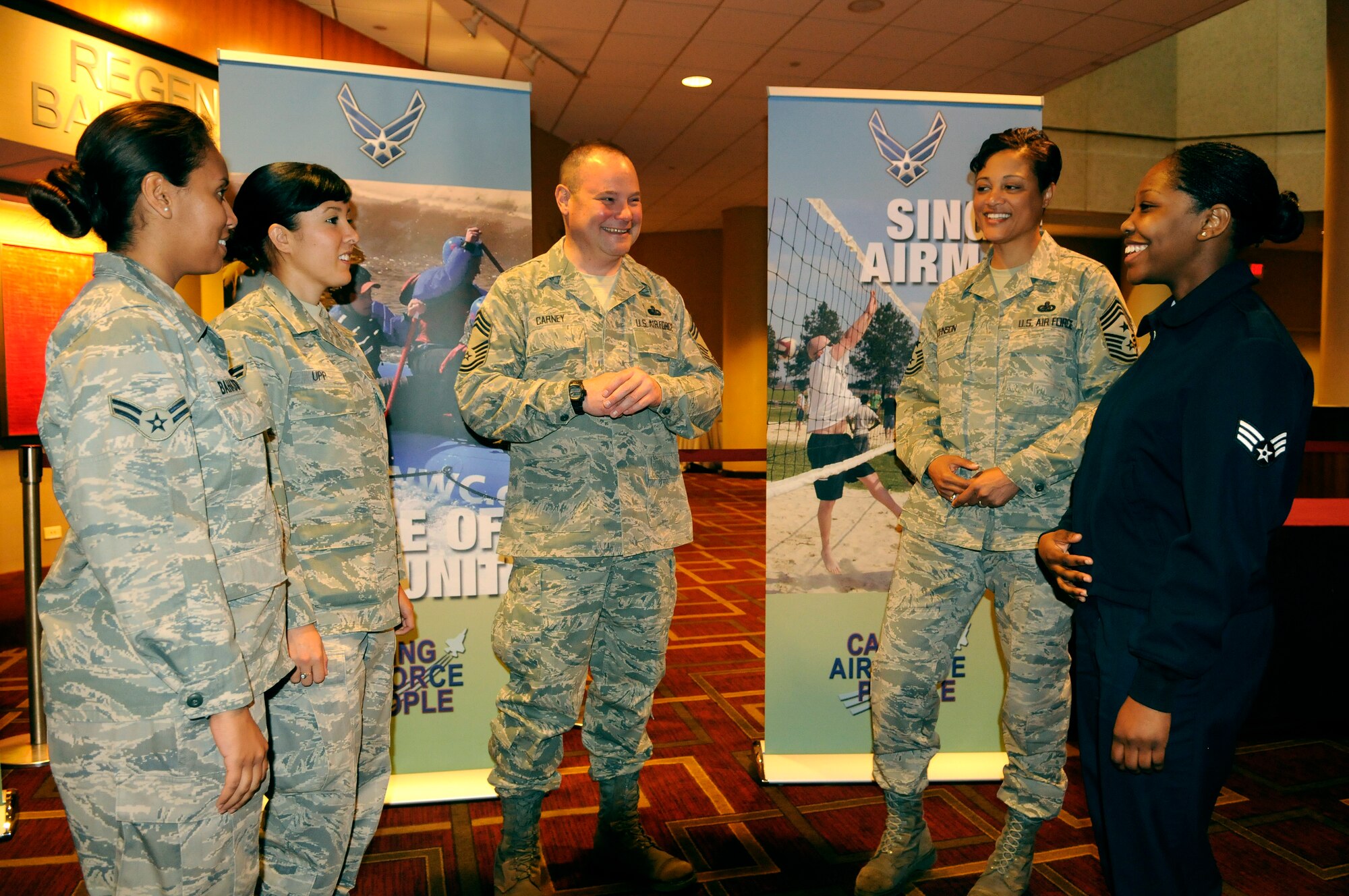 Chief Master Sgt. Robin Johnson, 11th Wing command chief master sergeant and Chief Master Sgt. Don Carney, Services career field manager, speak with some of the single Airmen working group members they led during the 2010 Air Force Caring for People Forum April 19-21.  The working group at the Caring for People Forum allowed a group of single Airmen to create initiatives and solutions to present to Air Force senior leaders. (U.S. Air Force photo by Staff Sgt. Dan Decook)