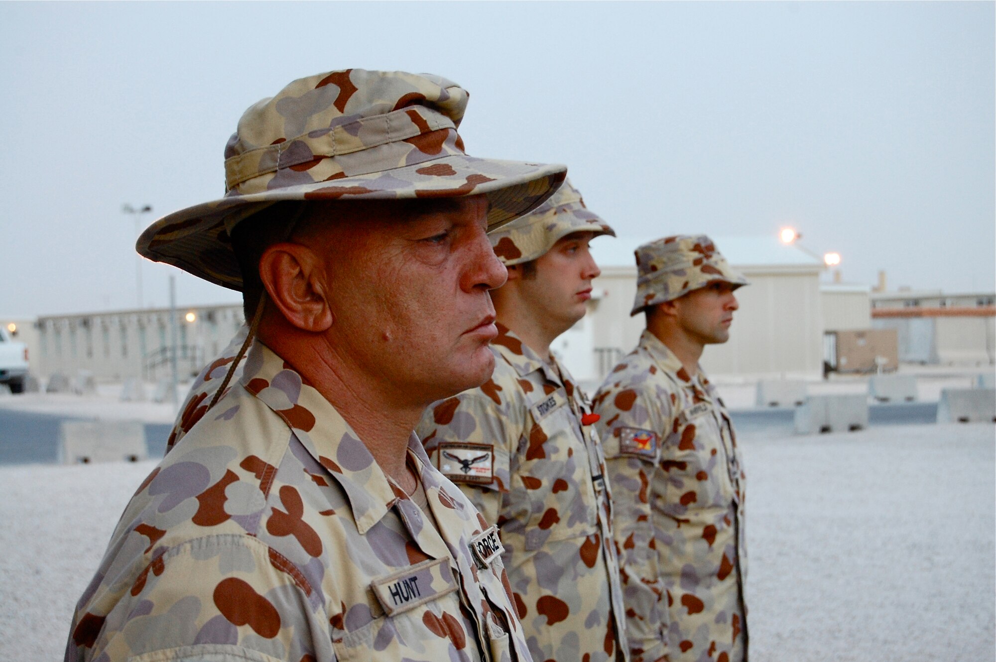 Squadron Lieutenant Glen Hunt, Royal Australian Air Force, stands at attention during the Australian and New Zaland Army Corps Day dawn service here April 25, 2010.  (U.S. Air Force photo/Maj. Chad Steffey/released)