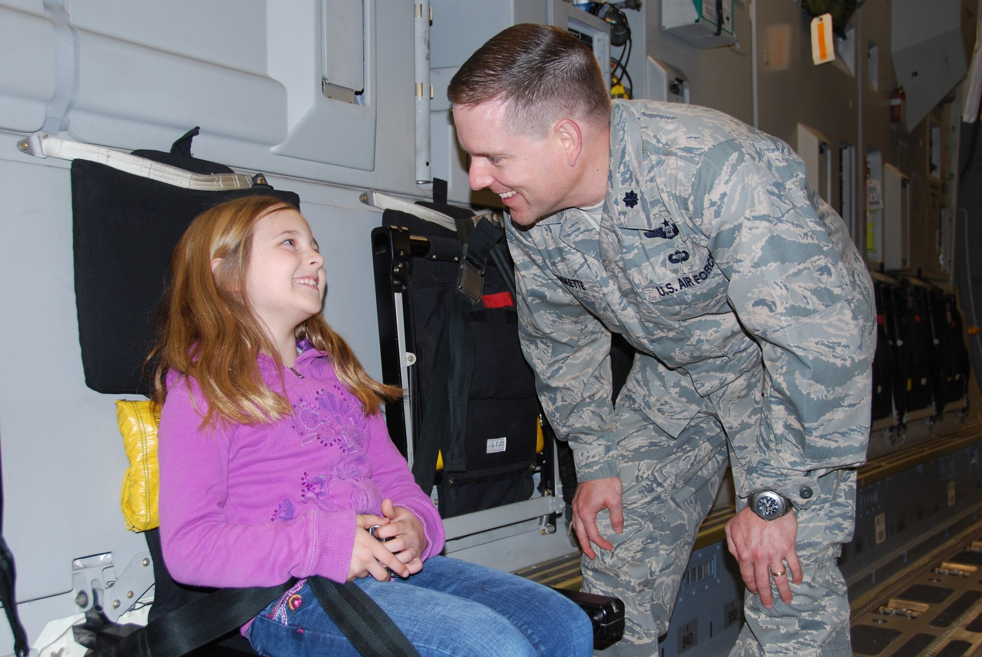 JOINT BASE MCGUIRE-DIX-LAKEHURST, N.J. - Lt. Col. Robert Baskette of the 21st Air Mobility Operation Squadron shares some time with his daughter, Jordan, at the C-17 Globemaster III static display; one of several sites more than 60 members visited April 22 during National Bring Your Child to Work Day. (U.S. Air Force photo/Master Sgt. Donna T. Jeffries)