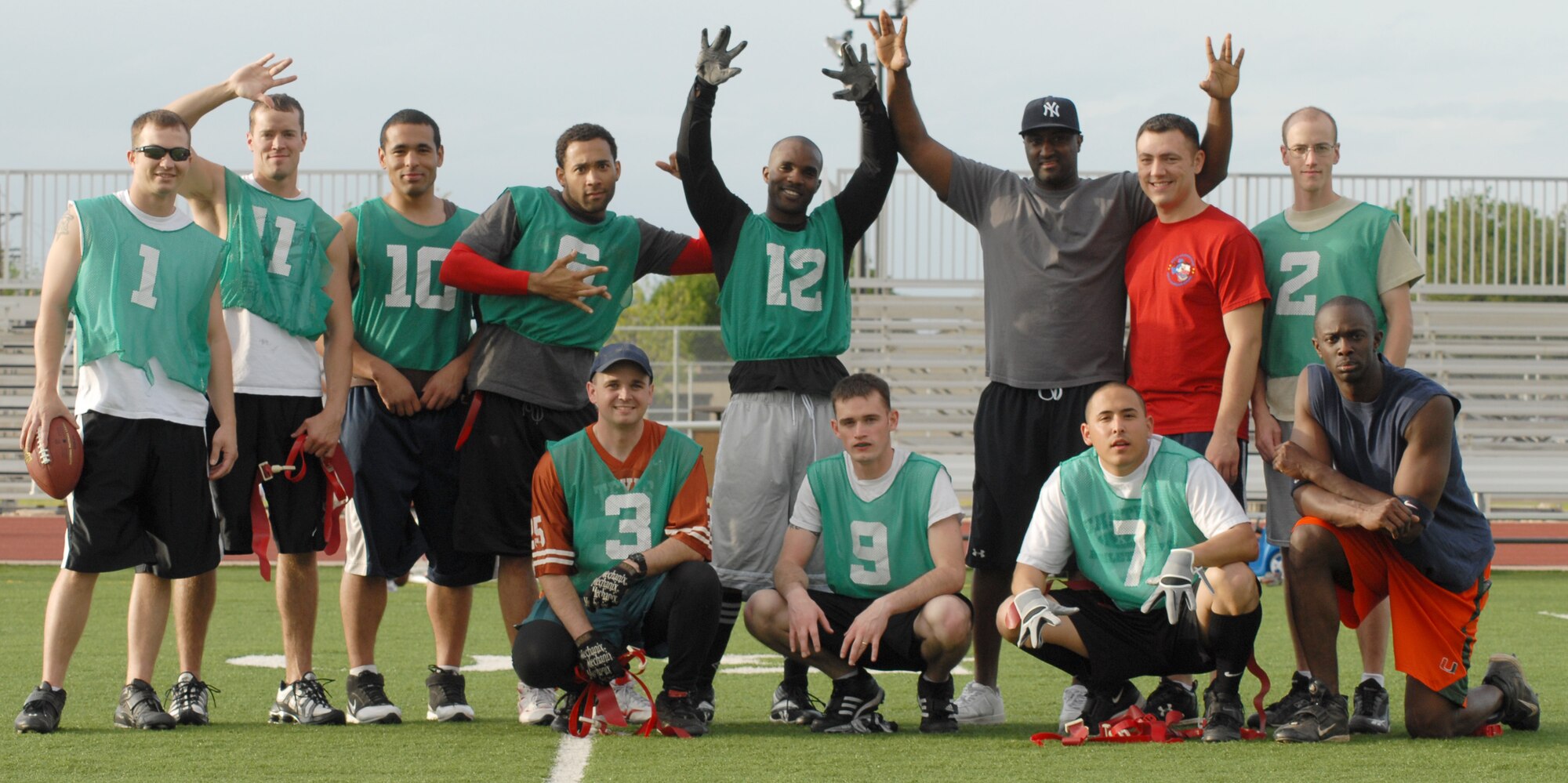GOODFELLOW AIR FORCE BASE, Texas--Members of the 56 Council football team gather for a celebratory photo after defeating the ACE team 27-0 at the base football field, April 23. Back row from left: Christopher Guy, 344th Military Intelligence Battalion; Robert Barry, 17th Security Forces Squadron; Brandon Foster 17 SFS; Timothy Harris, 316th Training Squadron; Jamaal E. Chesney, 315th Training Squadron; Jamal Mikell, 17th Training Wing; Jarrod Murrey 315 TRS and Eric Reynolds 312th Training Squadron. Bottom from left: David Sims 17th Communication Squadron; Jonathan Shifflett, 344 MIB; Jaime Correa 17 SFS and Jason Beckles, 344 MIB. (U.S. Air Force photo/ Senior Airman Tong Duong)