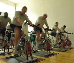 LANGLEY AIR FORCE BASE, Va. -- Airmen participate in an intense spin class as part of the 'Back to Basics' course April 13. The participants attend daily hour-long workouts designed to increase their fitness test scores and promote healthier lifestyles. (U.S. Air Force photo/Airman 1st Class Jason J. Brown)