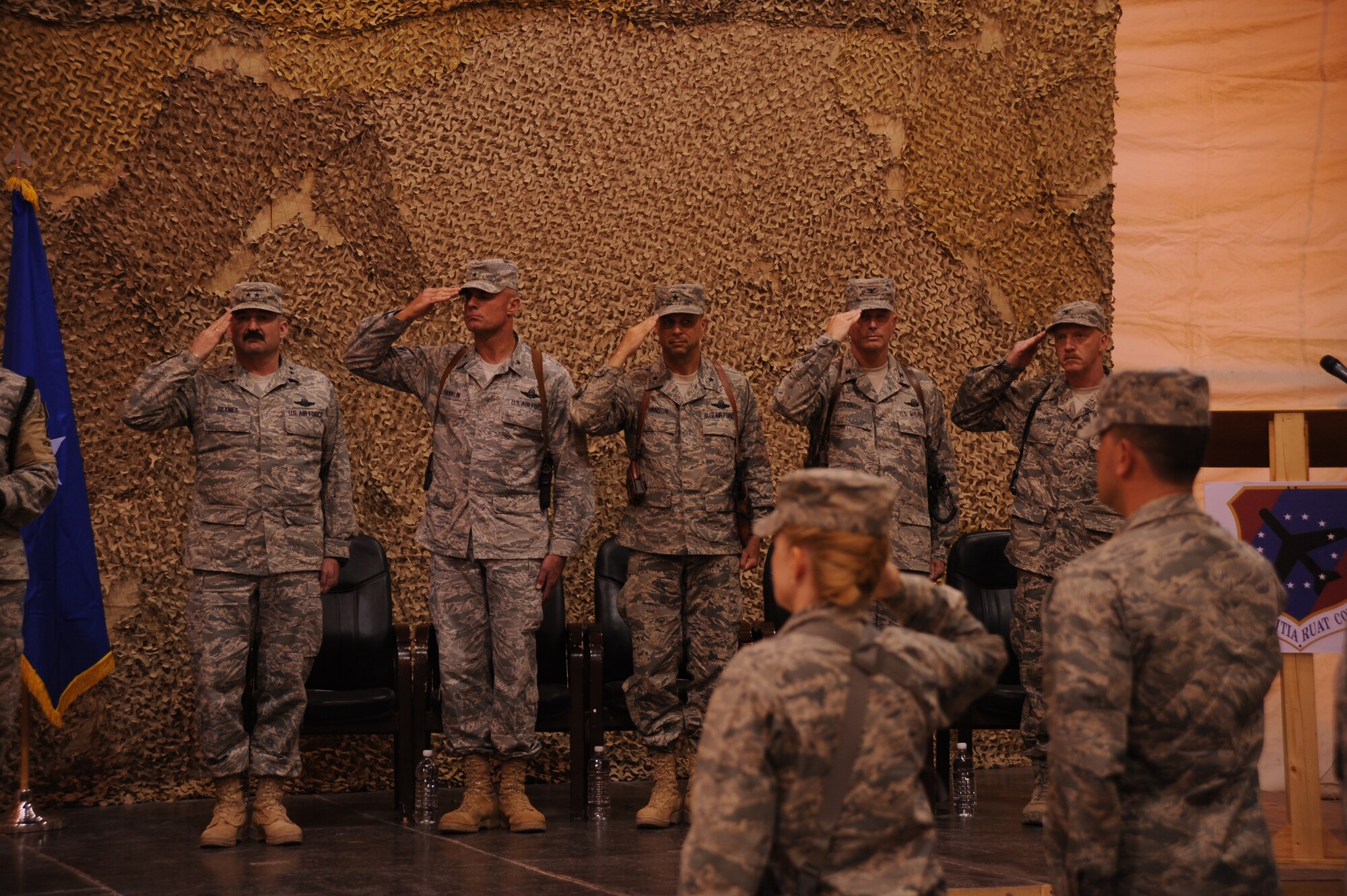 Maj. Gen. Joseph Reynes Jr., director, Air Component Coordination Element U.S. Forces- Iraq, Brig. Gen. Scott Hanson, 321st Air Expeditionary Wing commander, Brig. Gen. Craig Frnaklin, 332nd Air Expeditionary Wing commander, Col. Michael Cander, outgoing 447th Air Expeditionary Group commander, and Col. Bruce Taylor, incoming 447th AEG commander, hold salutes while the Nation Anthem plays during the 447th AEG transfer of authority and change of command here  April 24, 2010. 