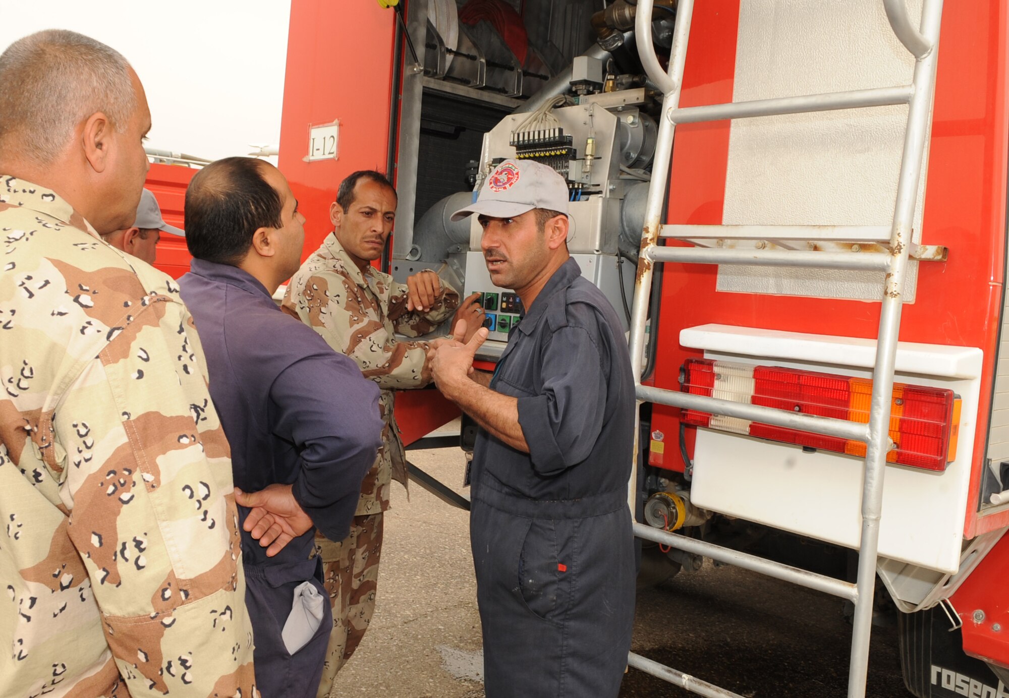 Members from the 506th Air Expeditionary Group and Iraq Training and Advisory Mission facilitated a maintenance education day between the Province of Kirkuk Fire Department (PKFD) and the Iraq Air Force Fire Department (IqAF/FD) at Kirkuk Regional Air Base, Iraq.  The PKFD members shared their knowledge of how to repair the European-type fire equipment with the IqAF vehicle maintainers.  (U.S. Air Force photo/Staff Sgt. Tabitha Kuykendall/Released)