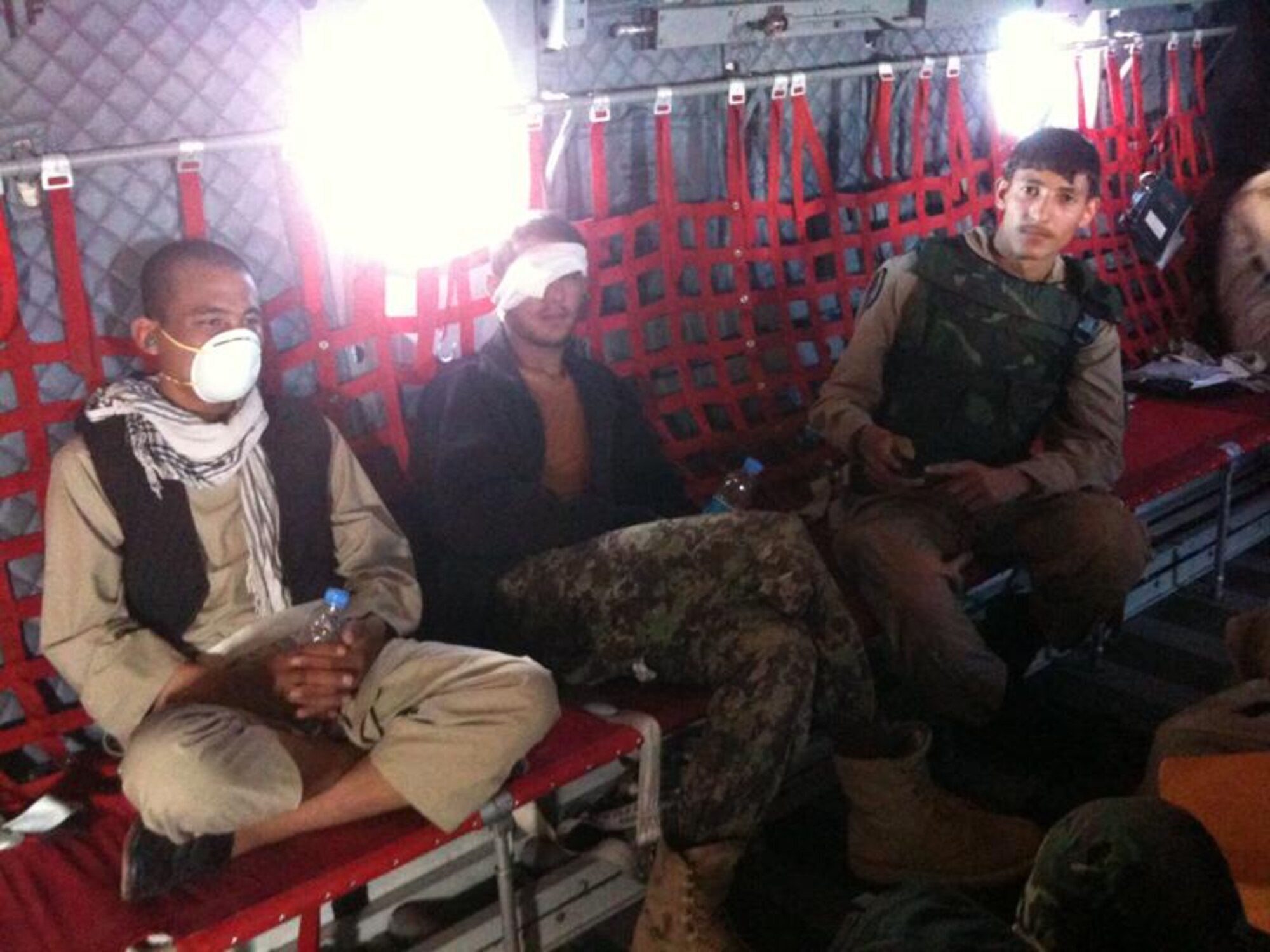 Patients receive medical care provided by Afghan National Army Air Corps medics on board a C-27 bound for Kabul on April 24, 2010. (US Air Force photo by Capt. Cassandra Ayott/RELEASED). 
