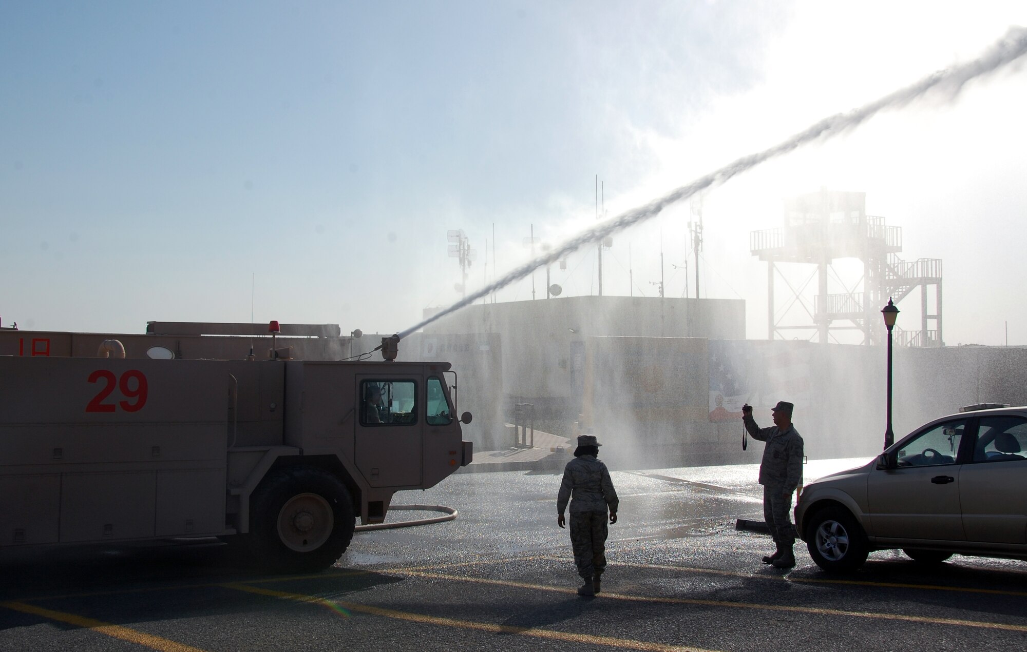 U.S. Air Force 386th Expeditionary Civil Engineer Squadron firefighters show Airmen how to operate their emergency response vehicles April 24, 2010 during the 386th ECES open house at an undisclosed location in Southwest Asia. Dozens of Airmen participated in the event in which they got an upclose look at fire department, explosive ordnance disposal and emergency management response equipment and spoke with experts in each career field. (U.S. Air Force photo by Tech. Sgt. Lindsey Maurice/Released)