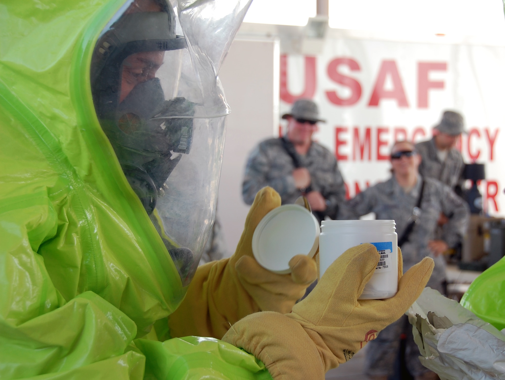 U.S. Air Force Senior Master Sgt. Todd Kern, 386th Force Support Squadron first sergeant, participates in a hazardous material response scenerio while wearing a level A HAZMAT suit April 24, 2010 during the 386th Expeditionary Civil Engineer Squadron open house at an air base in Southwest Asia. Dozens of Airmen participated in the event in which they got an upclose look at fire department, explosive ordnance disposal and emergency management response equipment and spoke with experts in each career field. (U.S. Air Force photo by Tech. Sgt. Lindsey Maurice/Released)