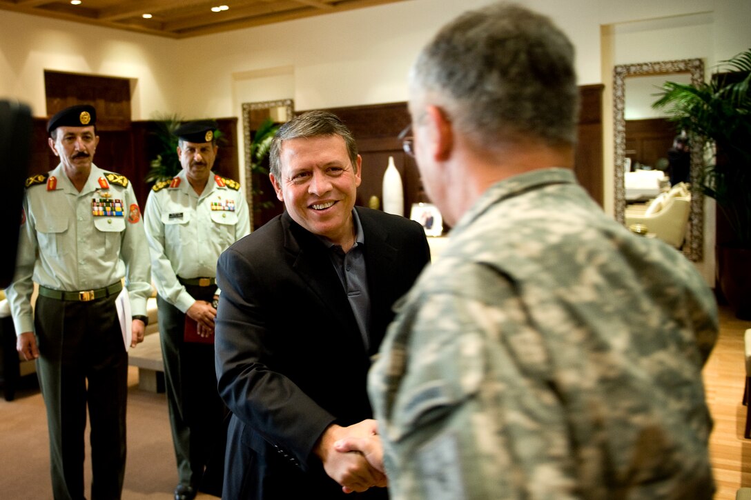 Jordan's King Abdullah II greets U.S. Army Chief of Staff Gen. George W. Casey Jr. at his office in Amman, Jordan, April 26, 2010. King Abdullah ll and Casey spoke about military relationships between the United States and Jordan.