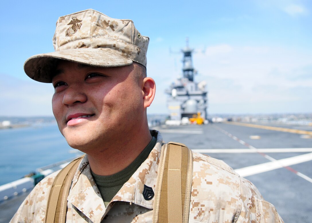 Staff Sgt. Santa Mercado, Marine Attack Squadron 311 maintenance controller, smiles as the USS Peleliu arrives at San Diego April 27, 2010, after the 15th Marine Expeditionary Unit’s final predeployment exercise. Six AV-8B Harriers and approximately 80 squadron Marines left Yuma April 15 to participate in their third and final predeployment training evolution. The exercise, which began April 16 and is scheduled to end April 27, included the entire 15th MEU. The squadron is slated to deploy with the 15th MEU in May, during which it will conduct counter-piracy operations in the Pacific and Indian Oceans.
