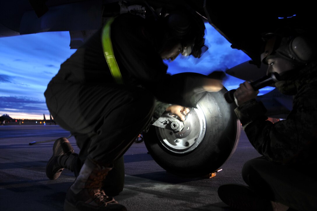 Marine Attack Squadron 211 powerline mechanics Lance Cpl. Rene Ramirez, left, and Lance Cpl. Rachelle Carl change a tire on a squadron AV-8B Harrier at the flight line of Eielson Air Force Base, Alaska, April 26, 2010. The Yuma-based Marines returned home May 4, 2010, with approximately 165 other VMA-211 Marines after two-and-a-half weeks of aerial warfare training in Exercise Red Flag-Alaska, one of the largest joint-service exercises in the U.S. military.